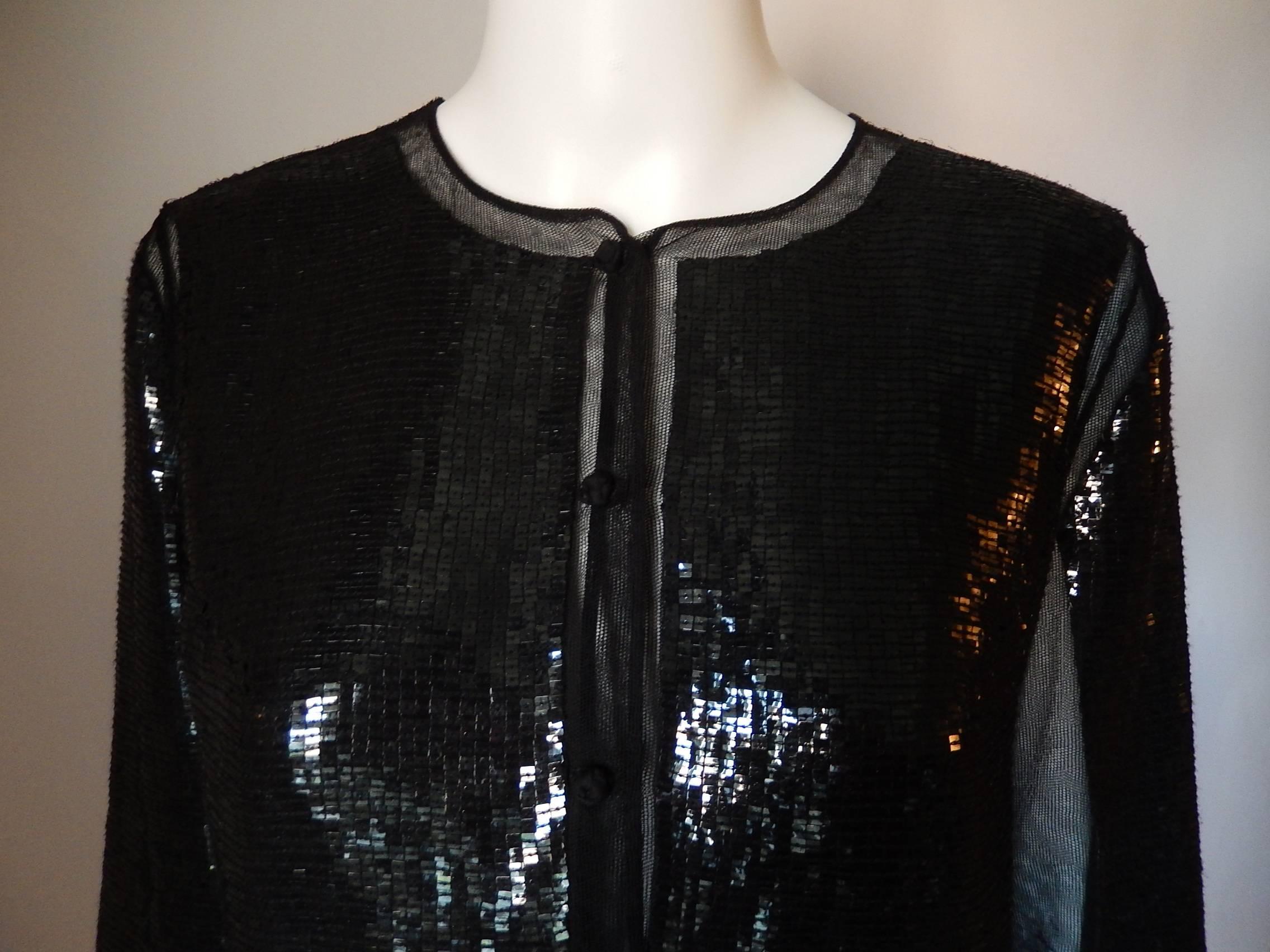 Chado Ralph Rucci all hand sewn black sequin cardigan.

Detail work with two front pockets and signature buttons down the front

Impossible to describe beauty

Size Tag reads 8:
Bust:  39