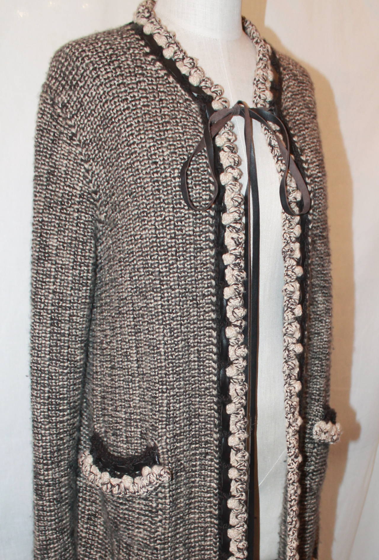 Chanel Brown Cashmere Woven Coat with Leather Trim - 40. This coat is in excellent condition and has crochet & leather trim.

Measurements:
Bust- 36