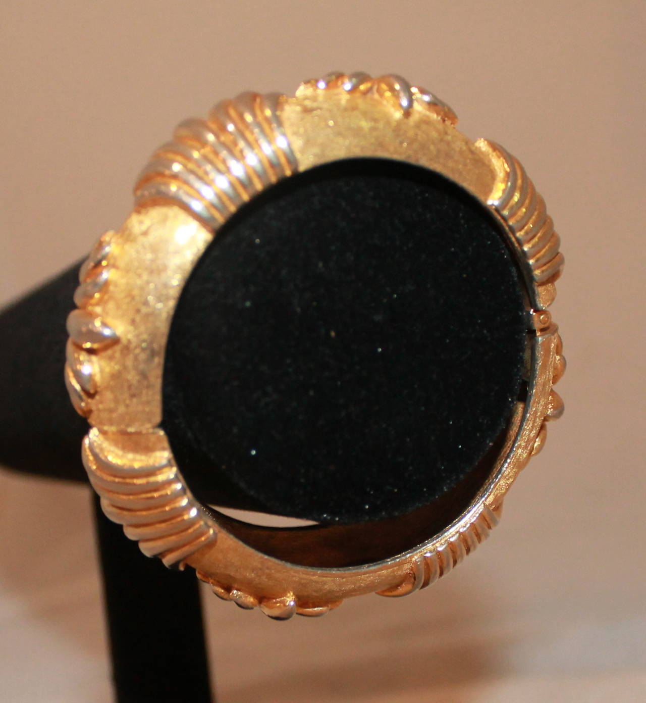 Kenneth Jay Lane Vintage Gold Etched Bangle - circa 1960s. This bangle is in excellent vintage condition. This is one of KJL's earliest pieces.

Width- 0.75