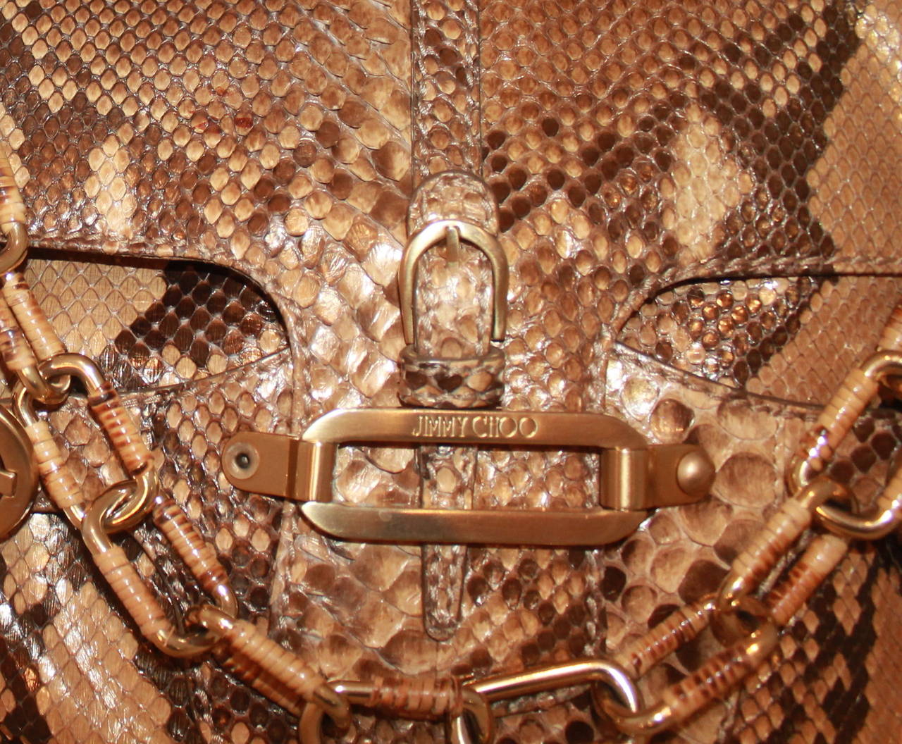 Jimmy Choo Earth Tone Metallic Python Shoulder Handbag. This handbag is in excellent condition.

Measurements:
Length- 9.5