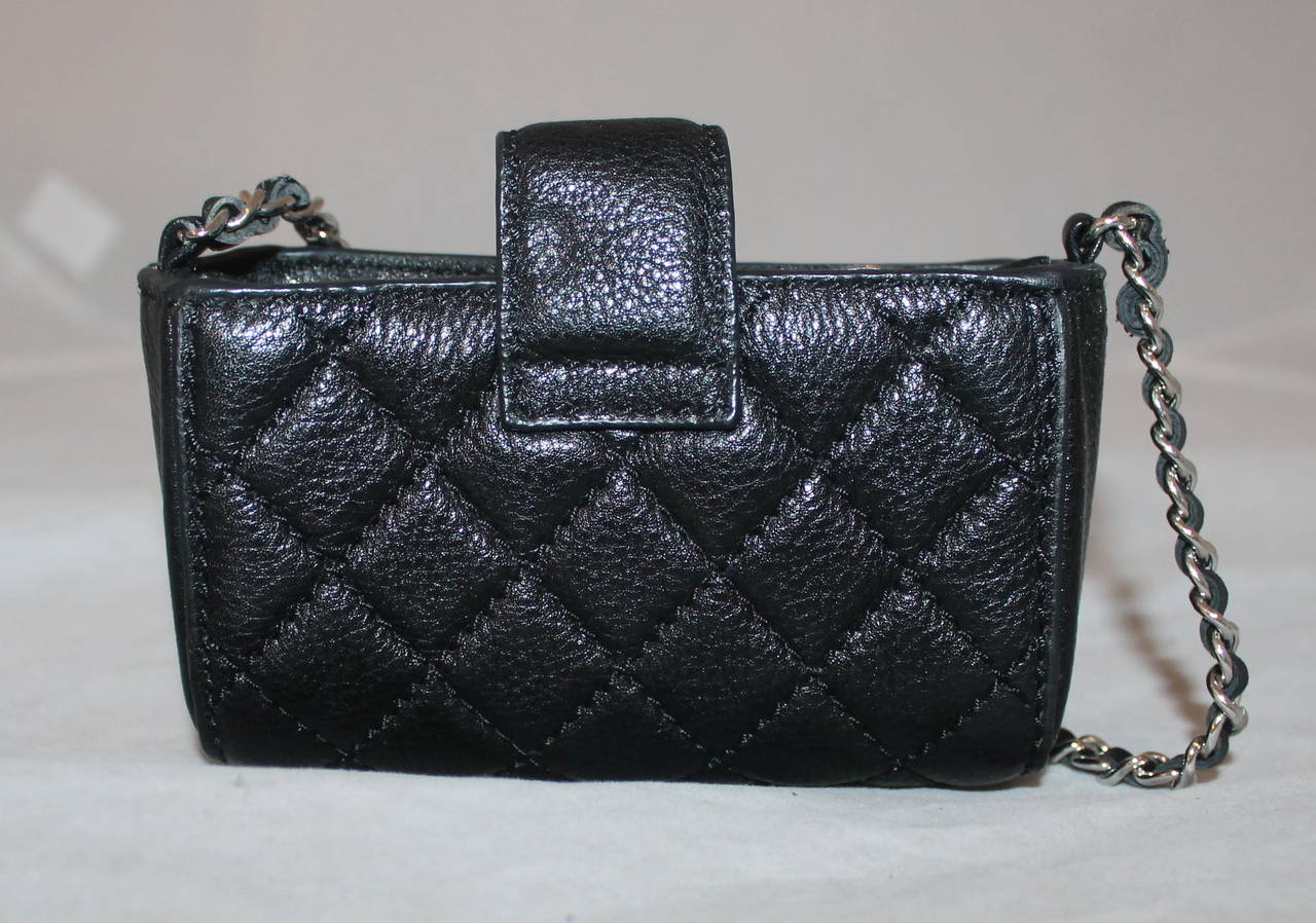 Chanel Black Caviar Wallet Cross Body Bag - circa 2010. This item is in excellent condition and comes with the authenticity card and duster.

Measurements:
Length- 3