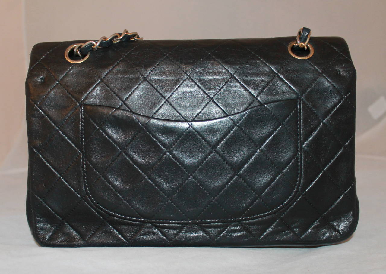 Chanel Vintage Black Lambskin Classic Handbag GHW - circa 1991. This bag is in  good condition with some discoloration on the chain. 

Measurements:
Length- 7