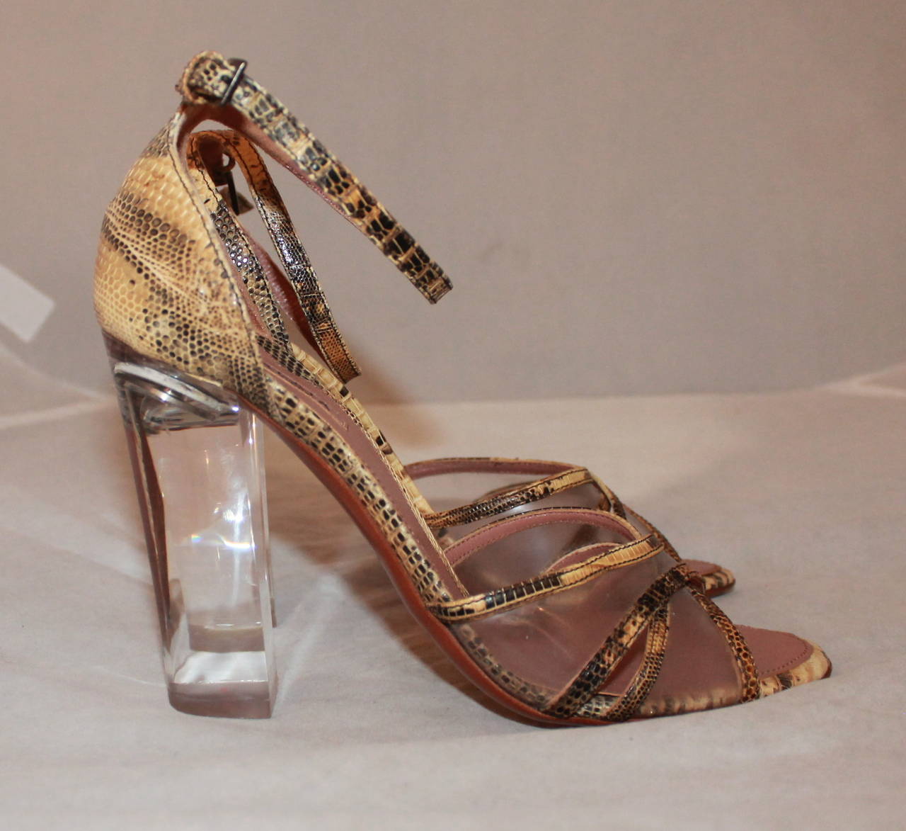 Alaia Earthtone Lizard & Lucite High Heel - 36.5. These shoes are in excellent condition with minor wear.