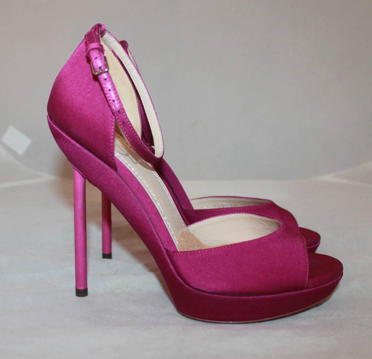 YSL Fushia Strapped Peep Toe Heels - 6.5. These shoes are in excellent condition with minor wear on the bottom.