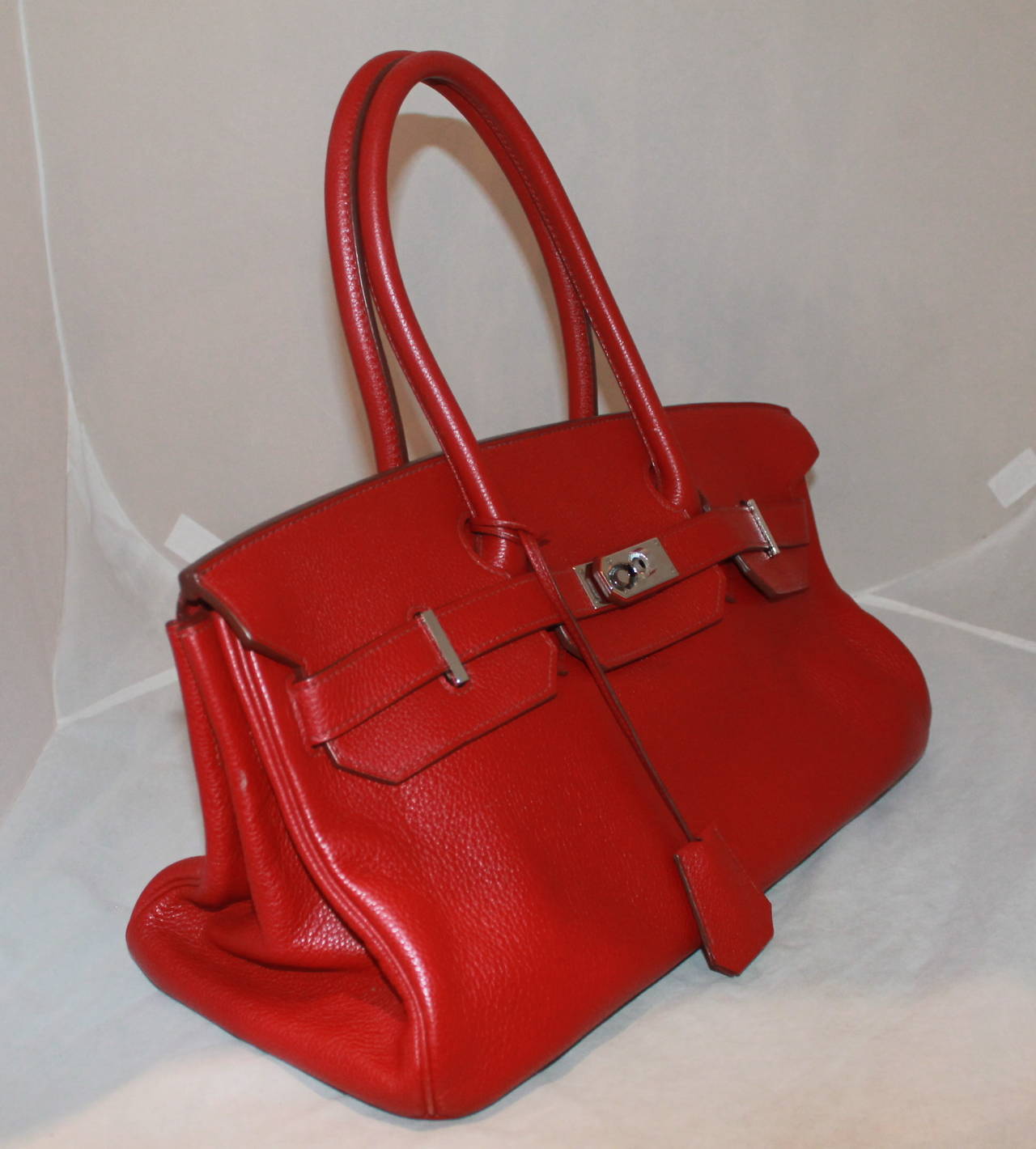Hermes Red JPG II Shoulder Birkin Handbag - 2009. This bag is in impeccable condition but is missing the lock. Extremely minor wear. 

Measurements:
Length- 9.5