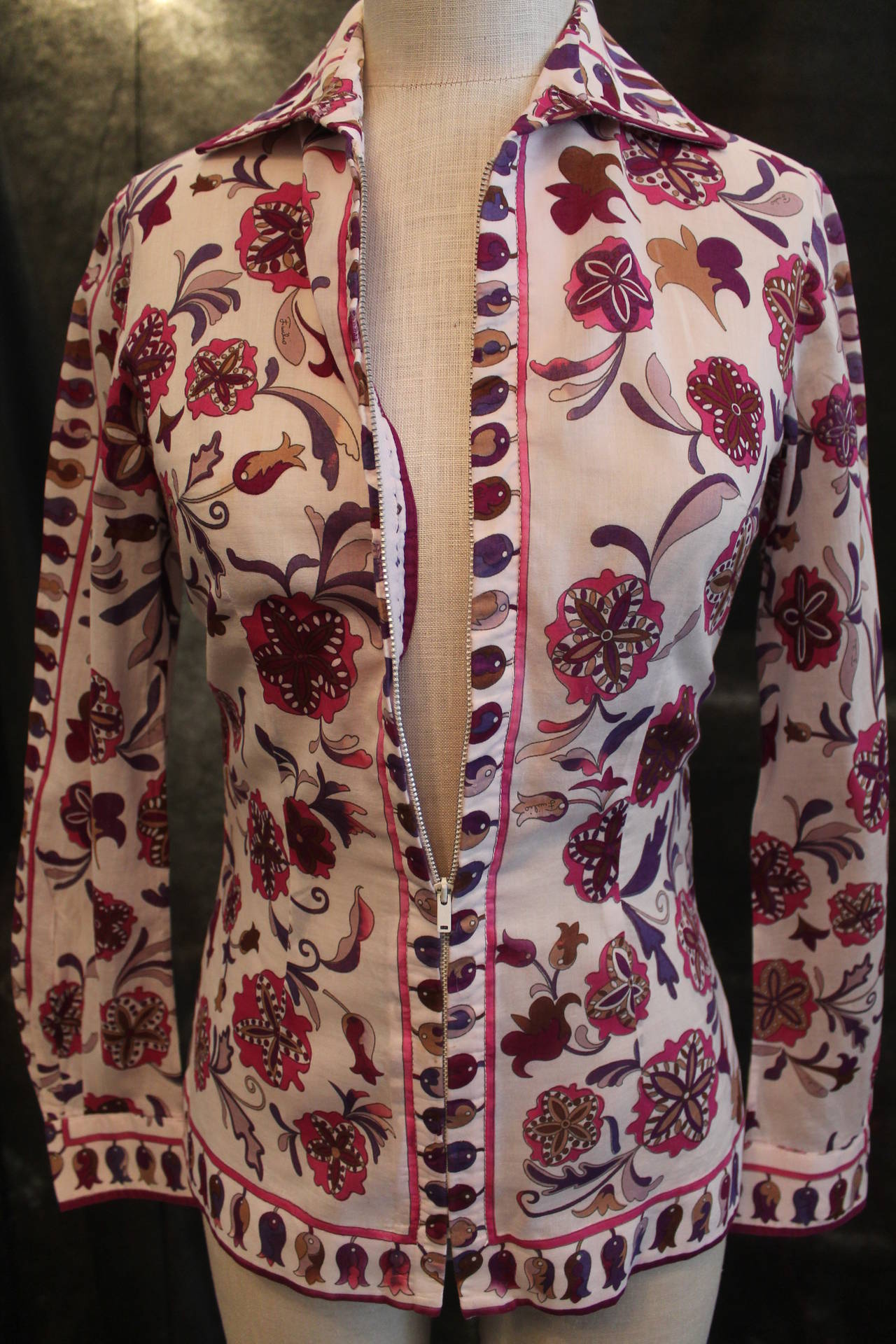 Pucci Vintage White, Purple, Pink Floral Print Jacket/Shirt - circa 1960s - S. This jacket is in very good vintage condition with minor wear. There is a matching skirt in stock. It is a vintage size 10. 

Measurements:
Bust- 34"
Waist-