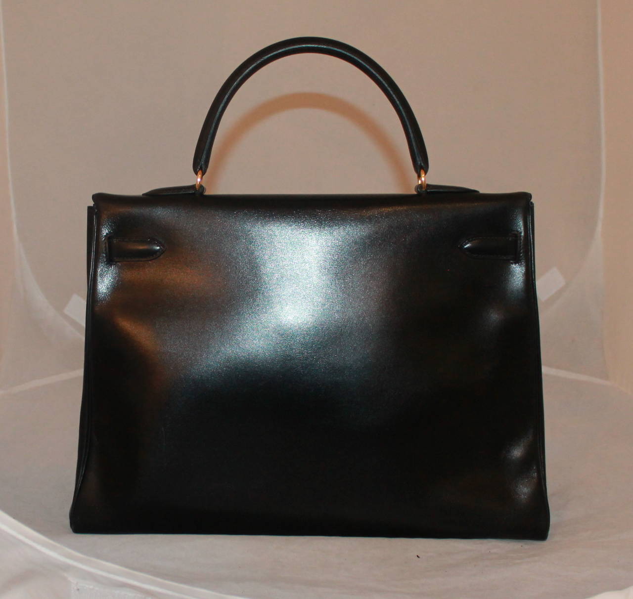 Hermes Vintage Black Box Calf 35cm Kelly Handbag GHW - circa 1993. This bag is in excellent vintage condition and comes with the longer strap and lock. 

Measurements:
Length- 10