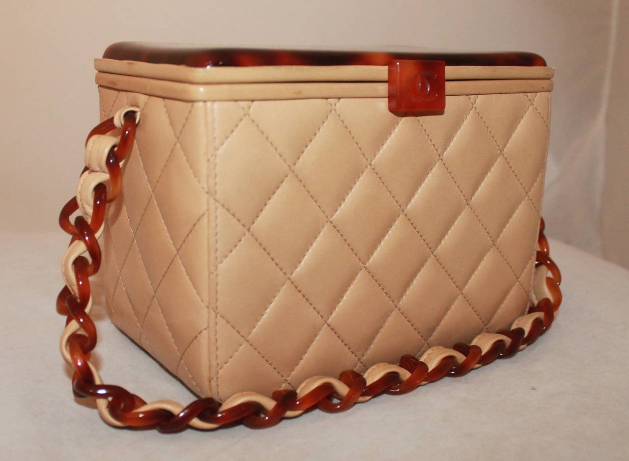 Chanel Vintage Beige Lambskin & Tortoise Top Box Handbag - circa 1997. This handbag is in excellent vintage condition with nearly no visible markings and signs of use. 

Measurements:
Length- 5