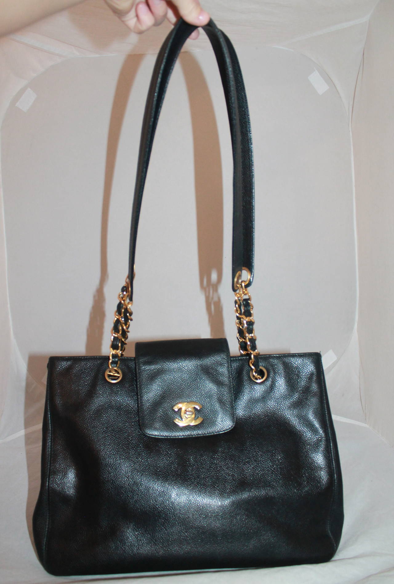 Chanel Vintage Black Caviar Tote Handbag GHW. This bag is in very good condition and is very roomy on the inside. The Chanel stamp make the dating on the bag unclear but it appears to be circa 1980-2000s. 

Measurements:
Length- 10