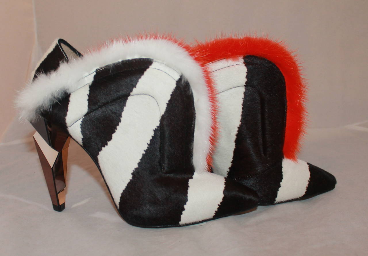 Fendi Striped Pony Hair & Fur Heel with Geometric Mirrored Heel - 36. The pony hair is chocolate brown and white. The fur is orange and white. These shoes are in excellent condition and are a very unique piece.