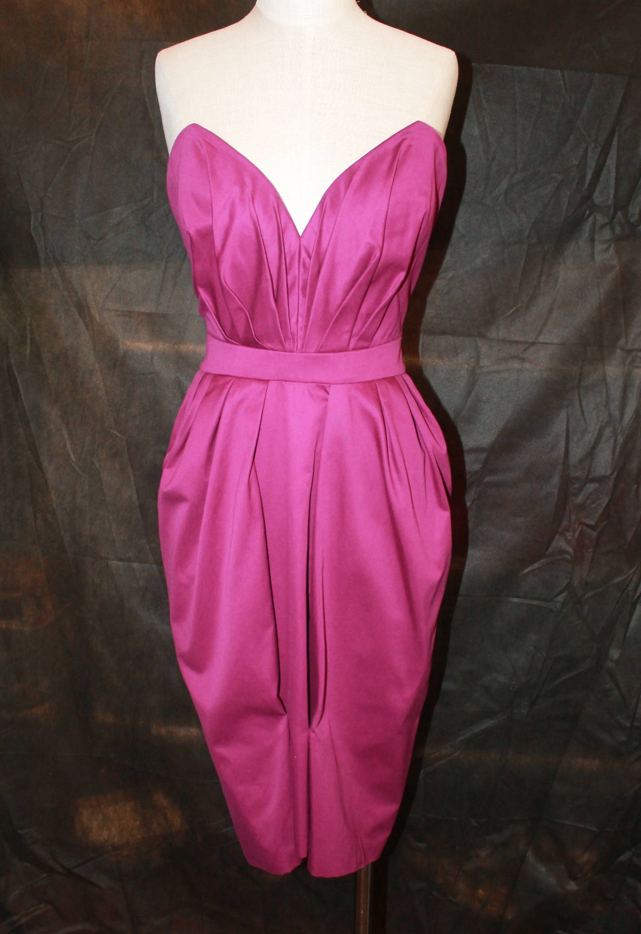 YSL Fushia Strapless Dress with Bolero/Caplet Jacket - S. This dress is in very good condition with little signs of wear. 

Measurements:
Dress Bust- 28"
Dress Waist- 26"
Dress Hips- up to 38"
Dress Length- 30" (centerback