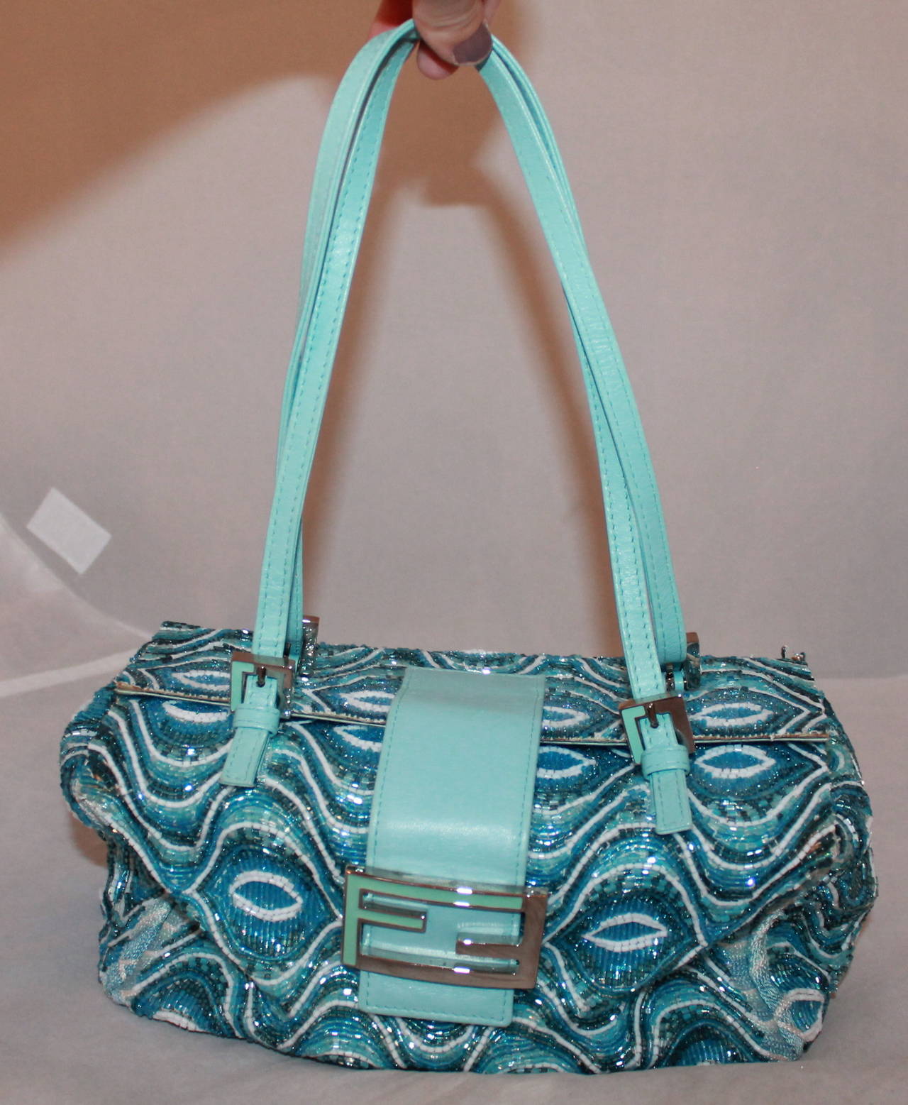 Fendi Blue Geometric Beaded Shoulder Bag. This bag is in fair condition with signs of wear on the inside lining and in some corners were the beading is starting to undo. It is a very unique piece.

Measurements:
Length- 5.25