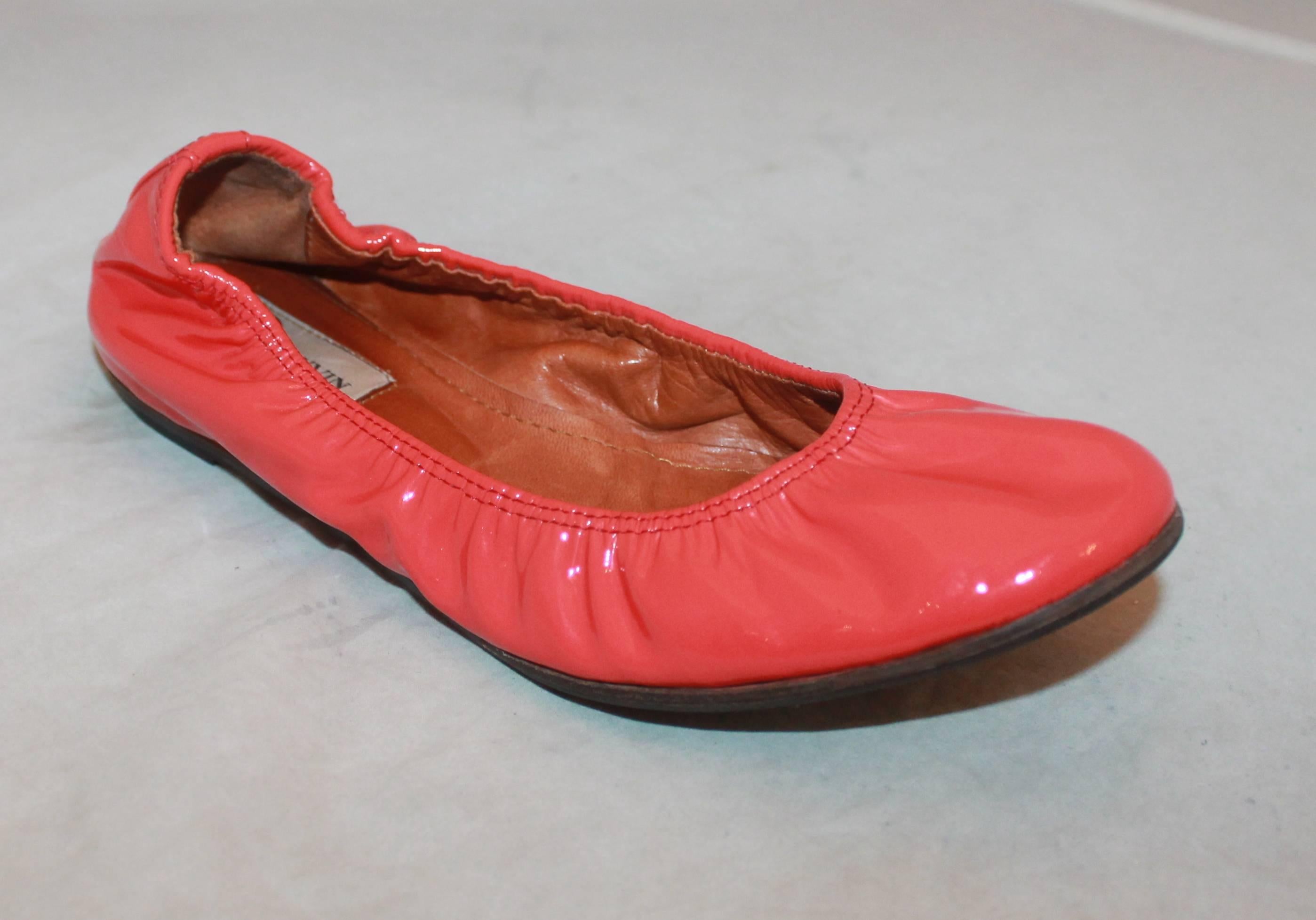 Lanvin Coral Patent Ballet Flats w/ Interior Leather Lining - 8.  These adorable flats are in excellent condition; they were worn maybe once.  They feature a gorgeous coral patent material, the ballet style, and a leather interior.