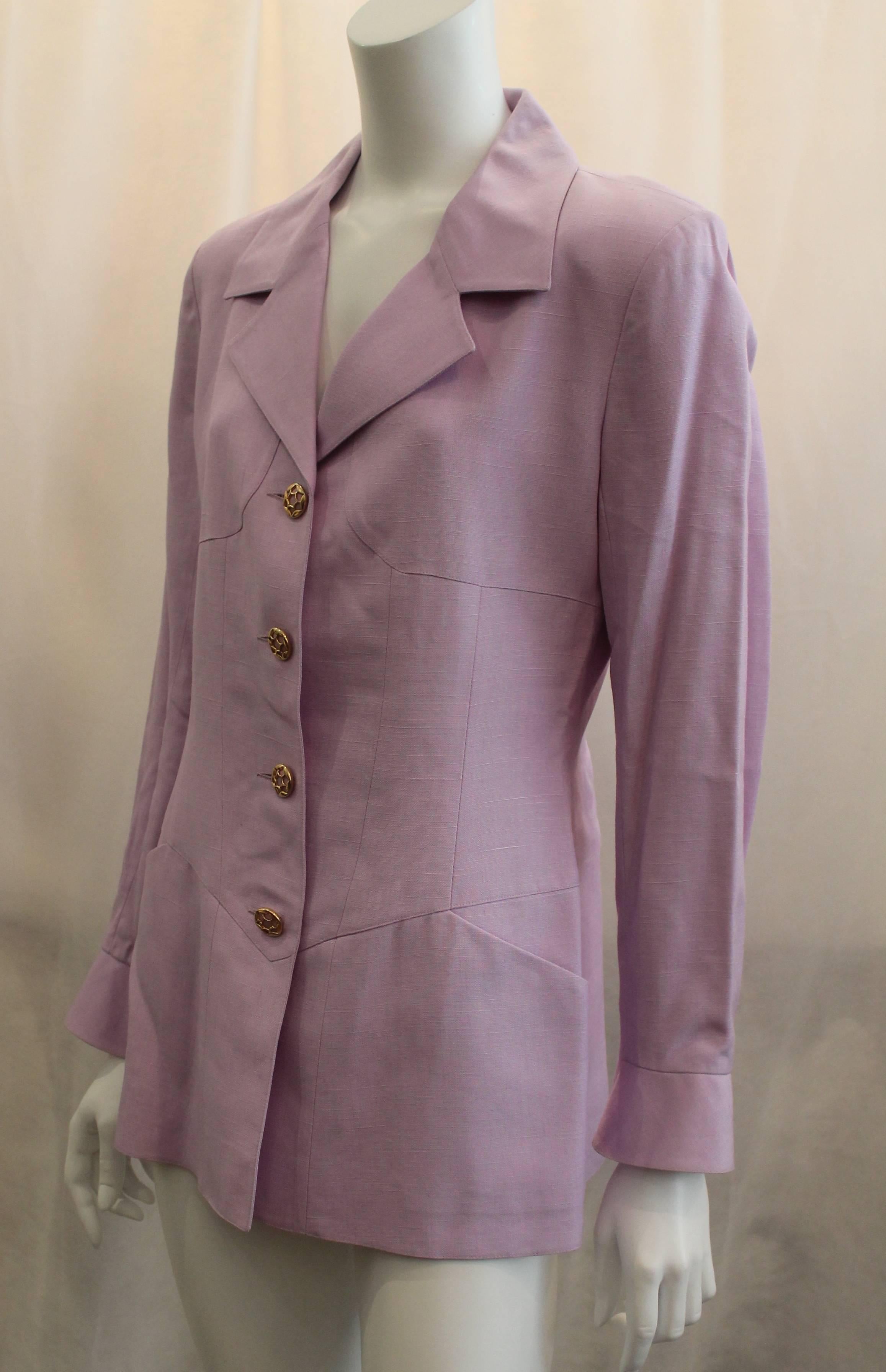 Karl Lagerfeld Lavender Linen-Viscose Blend Jacket - 42. This jacket features two pockets, gold and lavender buttons, a back bottom slit, and two buttons on the bottom of the sleeves.This jacket is in very good condition with a snag in the fabric on