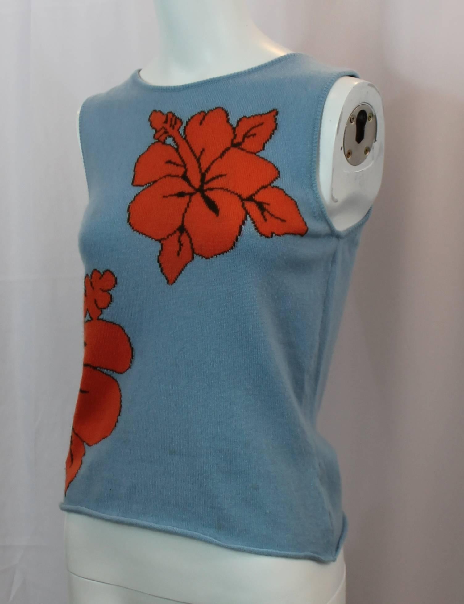 Lucien Pellat-Finet Sleeveless Blue Tropical Flower Printed Cashmere Top - S. This cute cashmere top is a blue color with 2 large, orange, hibiscus flowers on the front. It is in very good condition with some general wear to the fabric and a very