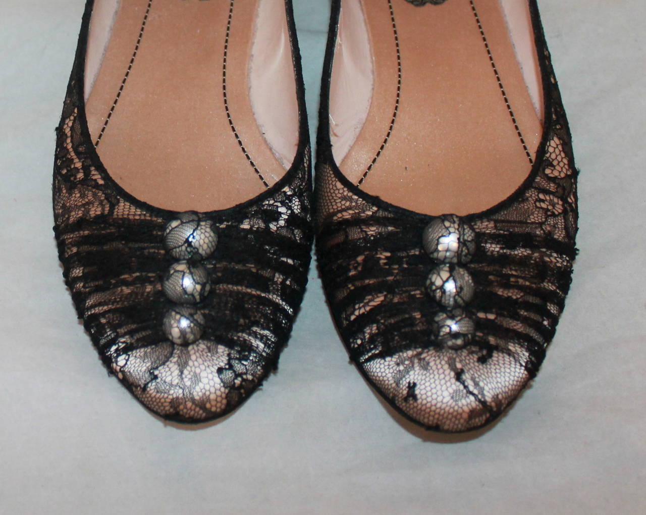 Rene Caovilla Pale Pink & Black Lace Flats with Pearls - 37. These shoes are in very good condition with wear on the bottom. Other than that, these shoes do not have markings.