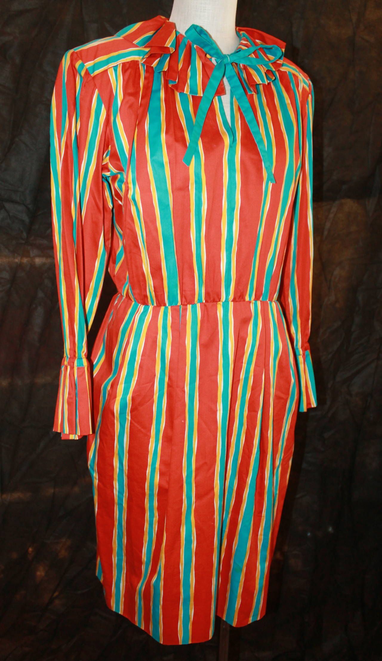 YSL 1960's Orange & Blue Striped Long Sleeve Dress - 6. This dress is in very good vintage condition with minor wear. 

Measurements:
Bust- 44