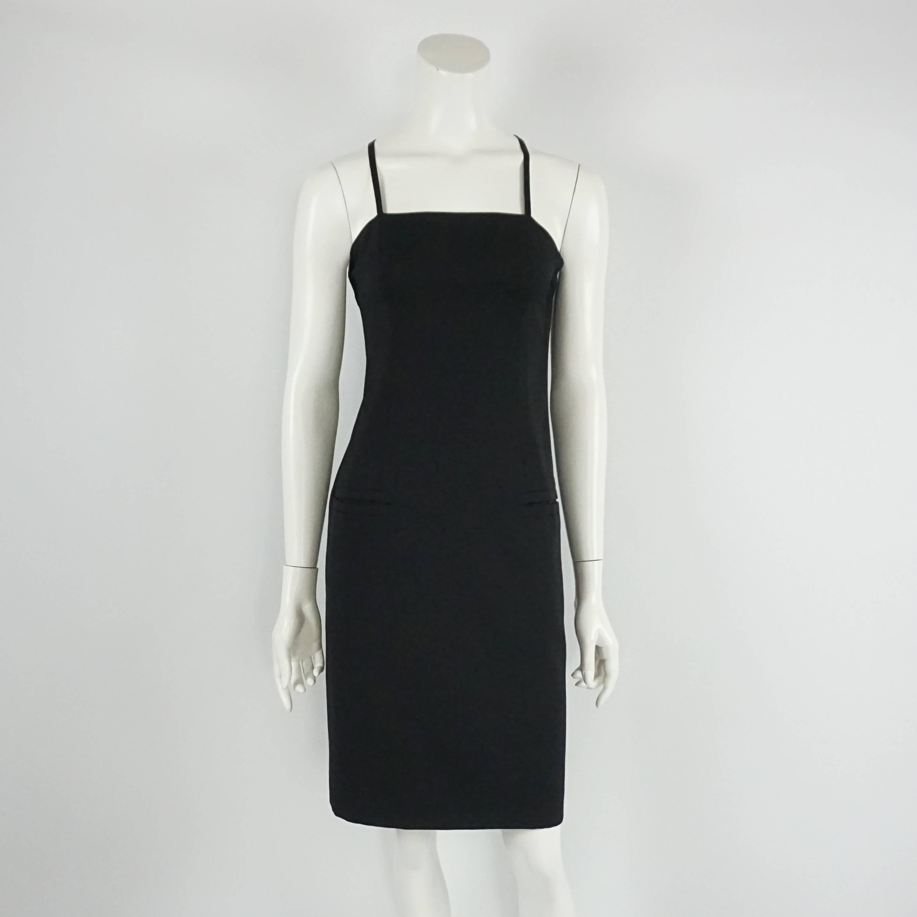 Yves Saint Laurent Black Dress with Bolero Jacket - 34 - Circa 90's  This very beautiful and elegant vintage YSL dress and jacket are in excellent condition. The dress is simple, fitted and with 2 thin straps that criss cross in the back. It has a