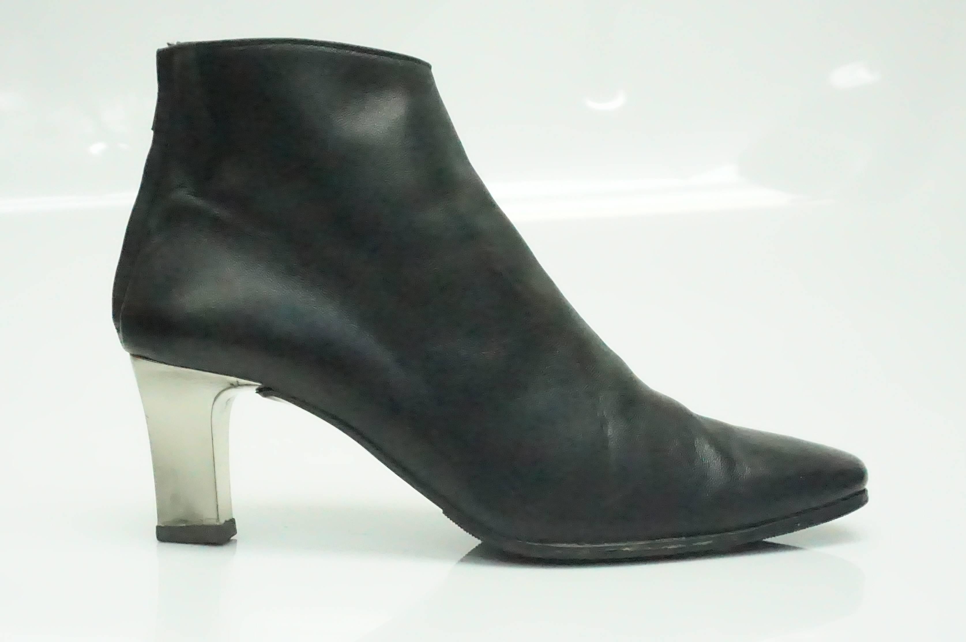 Ralph Lauren Black Leather Boots with Mirror Heels - 7. These amazing boots by Ralph Lauren Purple Label Collection are in good condition. The leather shows some sign of use and the bottoms have been re-done. They are made of black leather and have