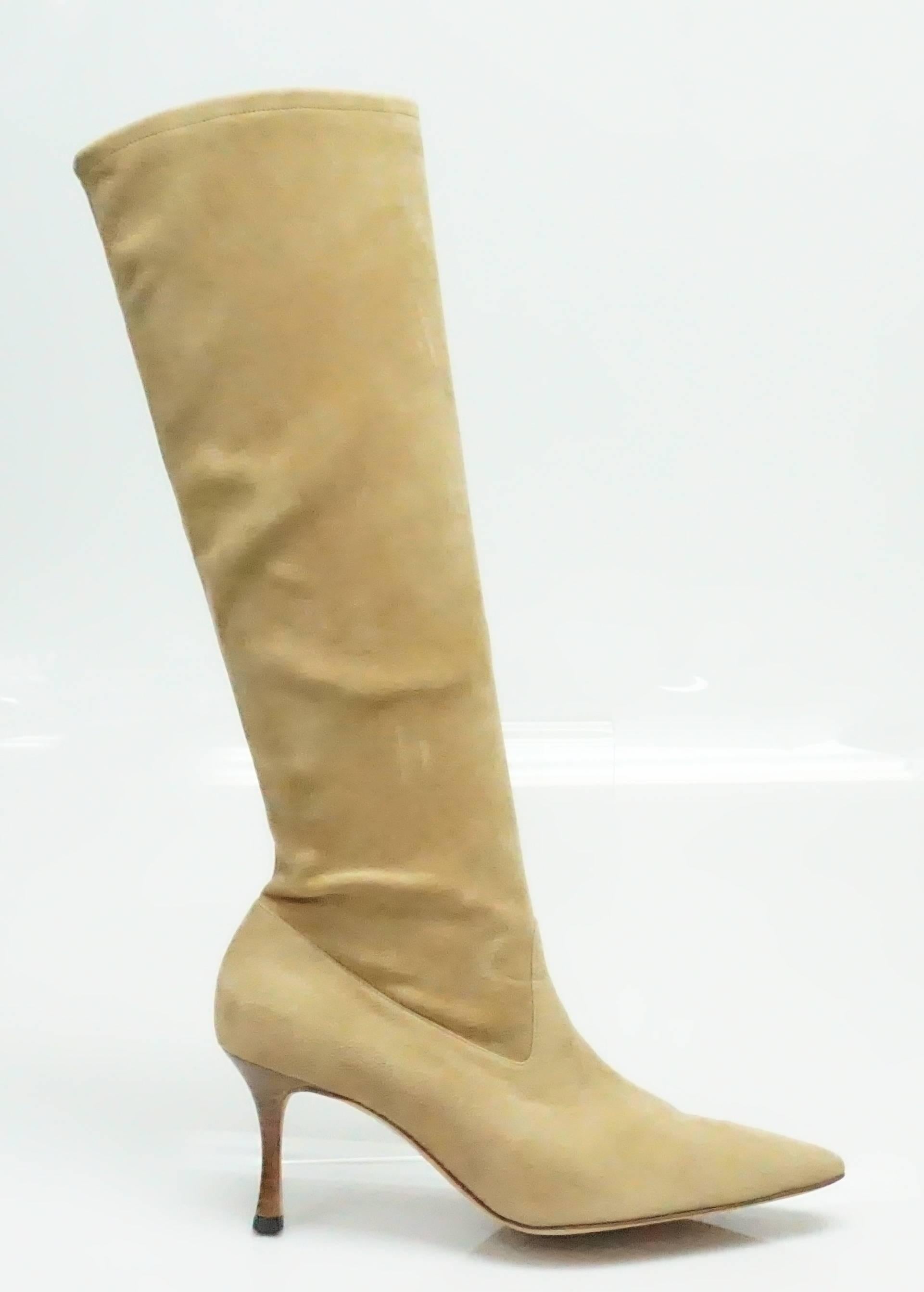 Manolo Blahnik Camel Suede Tall Boot - 38.5  These beautiful boots are in very good condition. They have stretch and do not have a zip. The heel is a stacked wood stiletto that is 3