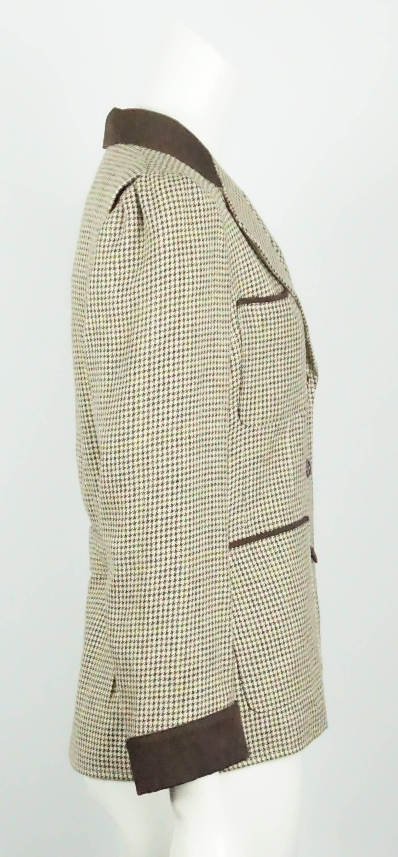 Yves Saint Laurent Earthtone Houdstooth 4 Pocket Wool Jacket - 40 - 70's  This timeless classic is perfect for any wardrobe. The jacket is in excellent vintage condition. The wool fabric is a brown and Ivory houndstooth with a hint of dark green. It