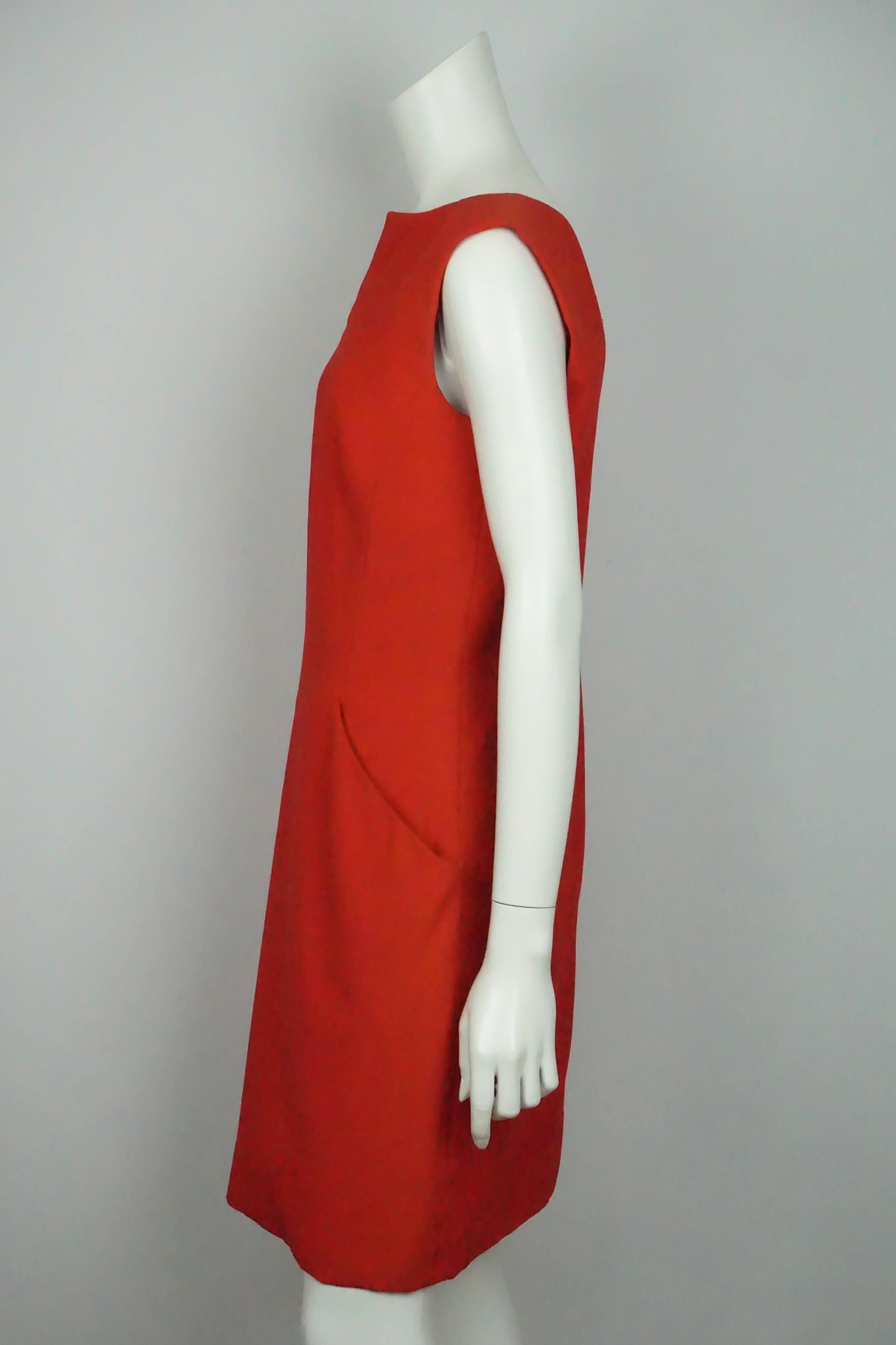 Alexander McQueen Red Sleeveless Sheath Dress - 44  This elegant dress is in good condition. The dress is made of a acetate/rayon material and is silk lined. The dress is sleeveless with a plunging back and a v to the waist. There is a slight slit
