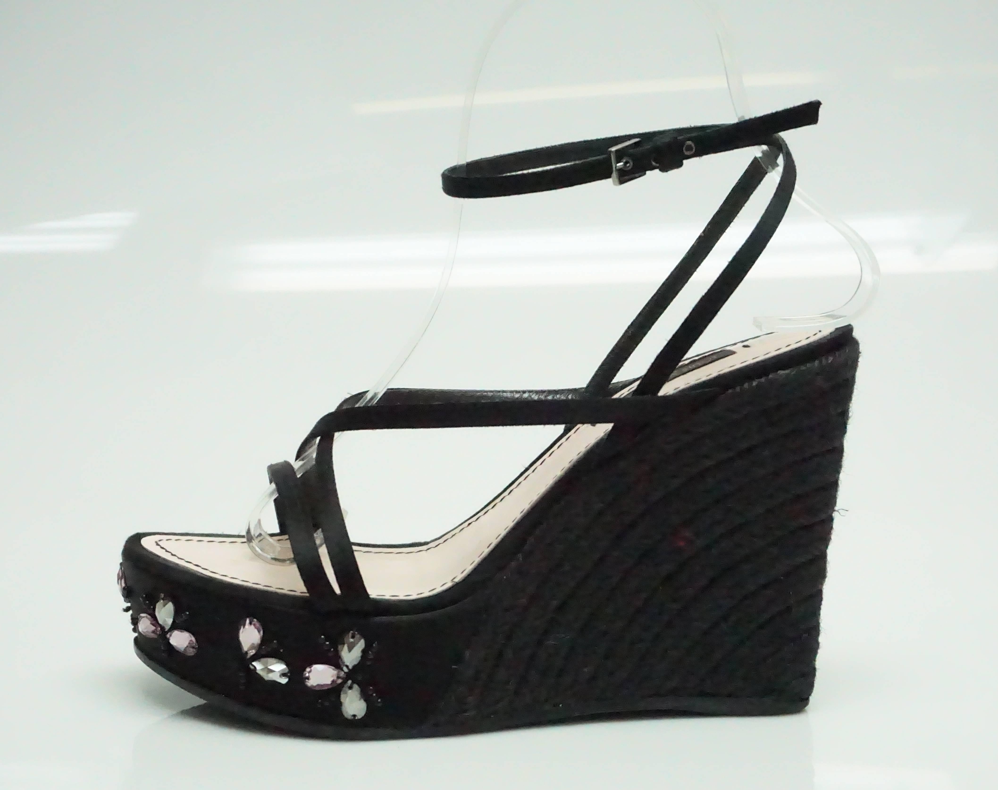 Louis Vuitton Black Silk and Raffia Wedge with Pink Stones - 37  These gorgeous wedges are in good condition. They are lightly used around the sole of the shoe and some of the pink jewels in the front are unattached from the string. The shoe's