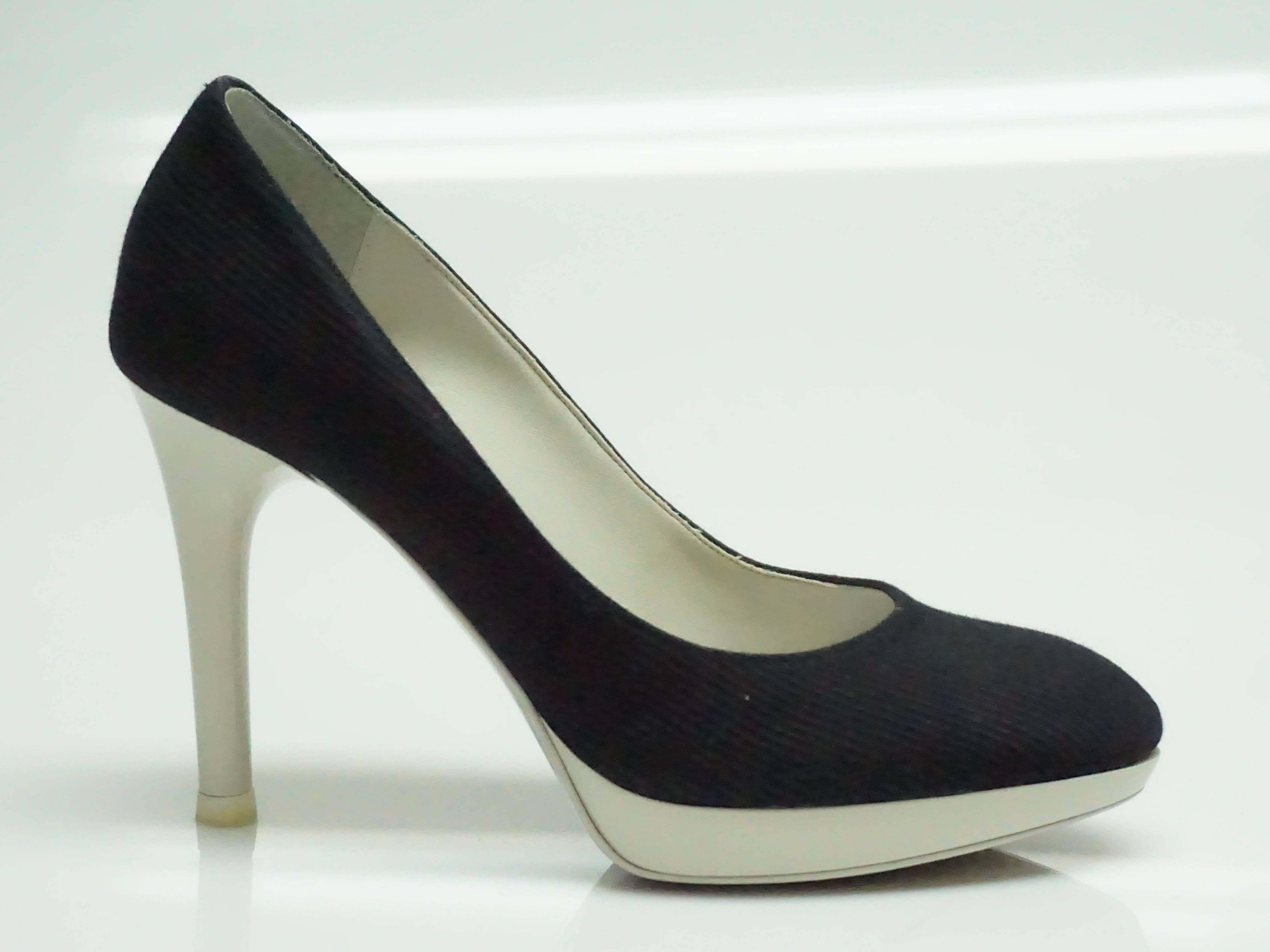 Stella McCartney Navy & White Pump - 36.5  These unique pumps are in excellent condition. The pump and heel are made of patent leather and are a soft grey color. The rest of the shoe is made of a navy fabric. The heel is 4