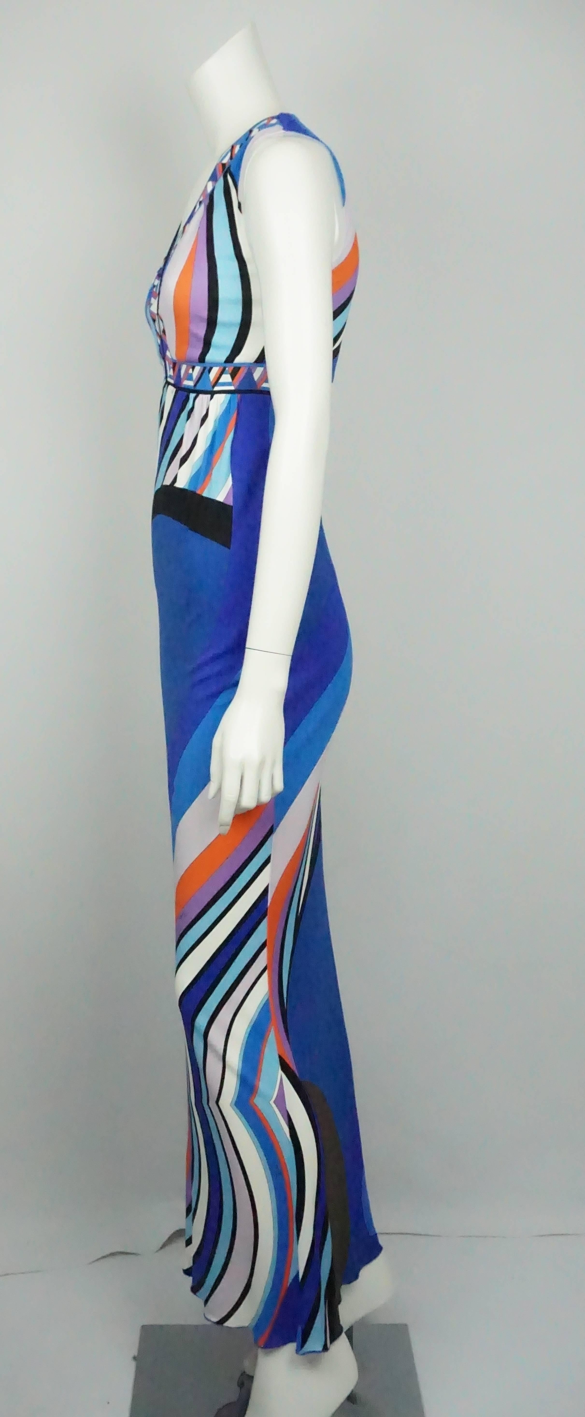Emilio Pucci Multi Print Sleeveless Maxi Dress - 4   This Emilio Pucci maxi dress is in excellent condition. The dress is sleeveless and the neck has a deep v shape. The dress is made of viscose and silk. The colors on the dress consist of blues,