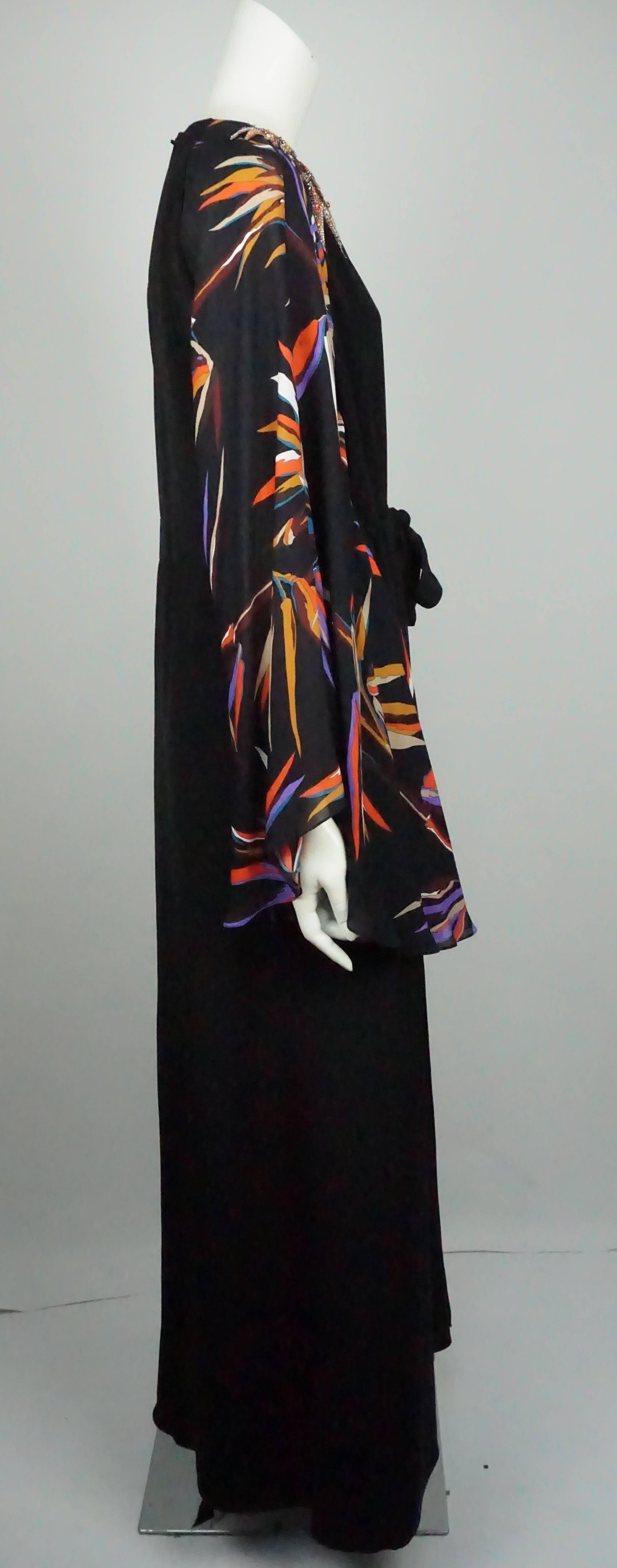 Emilio Pucci Black and Multi Silk Beaded Gown - 48  This gorgeous Emilio Pucci piece is in excellent condition. The dress has a beautiful beaded detail on the right side of the shoulder and is formed into a leaf shape. The jewels are made of up