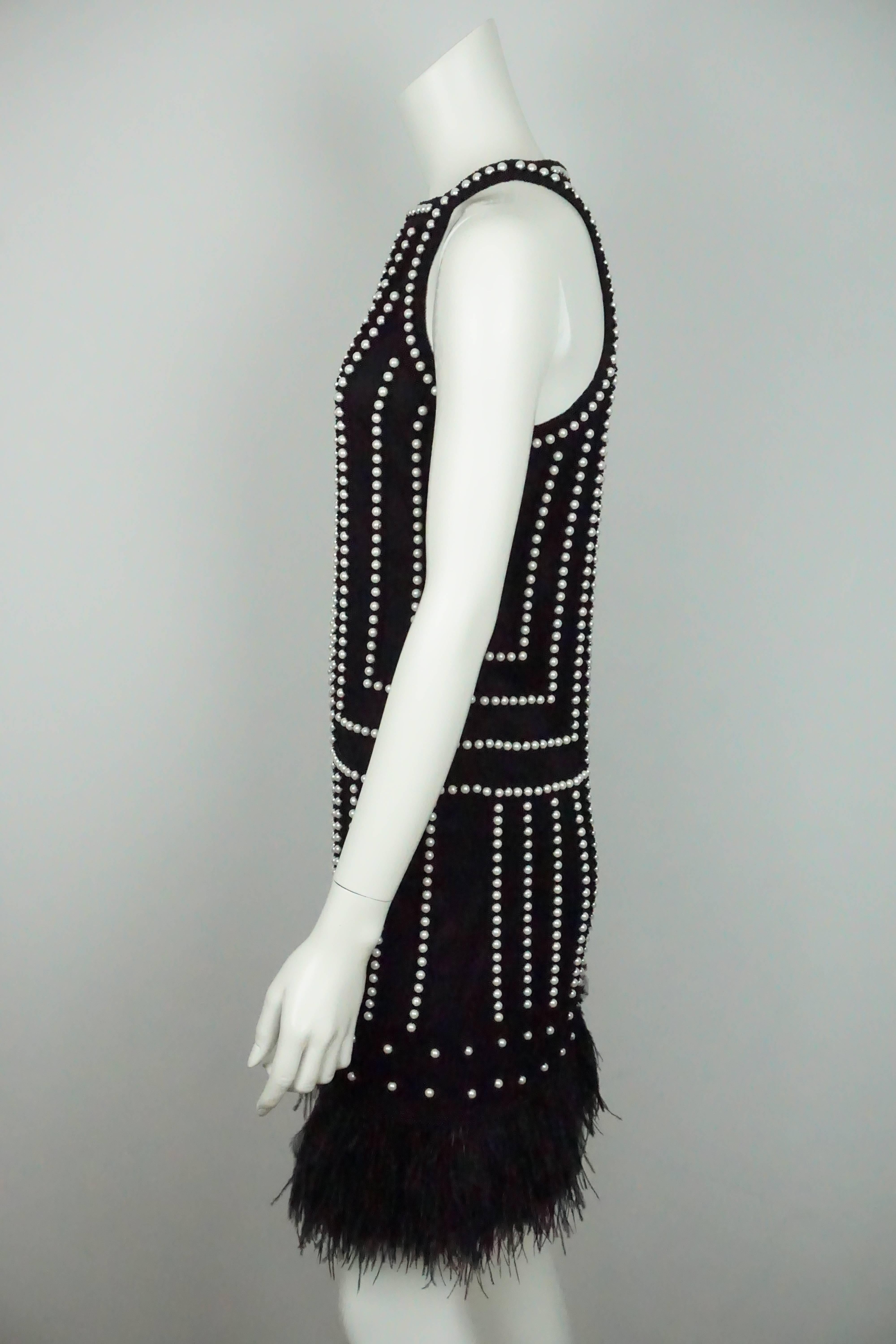Joanna Mastroianni Black Sleeveless Pearl Beaded Dress w/ Feathers - 2  This beautiful silk dress is in excellent condition. This dress has two layers, the first is the lining that is completely made of black silk. The second layer is a mesh