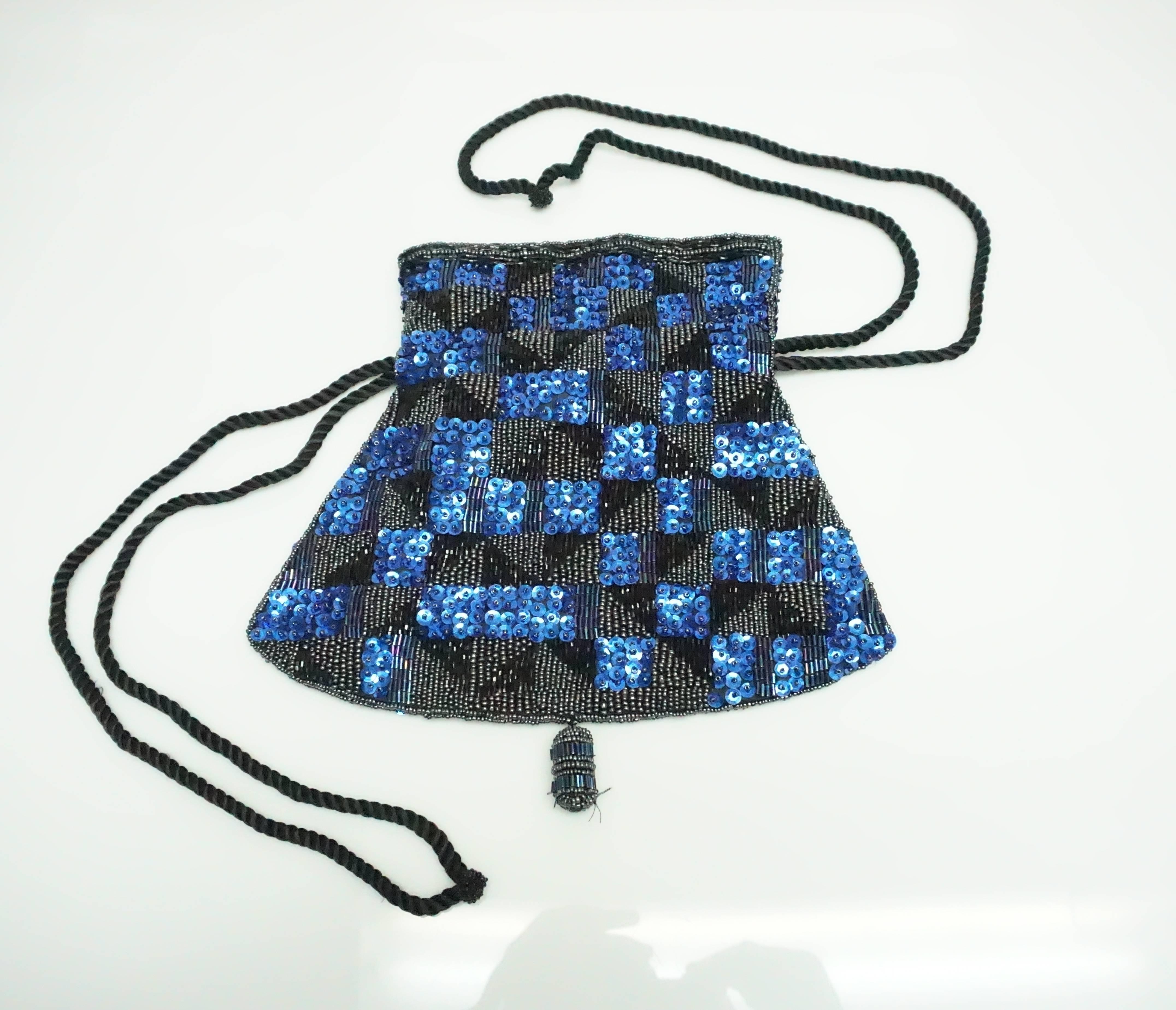Patrick Sweeney Blue and Black Sequin Bag   This beautiful vintage bag is in excellent condition. The bag is fully covered in sequin and beads. The top of the bag has a boarder of black and metallic beads. The rest of the bag is covered in a
