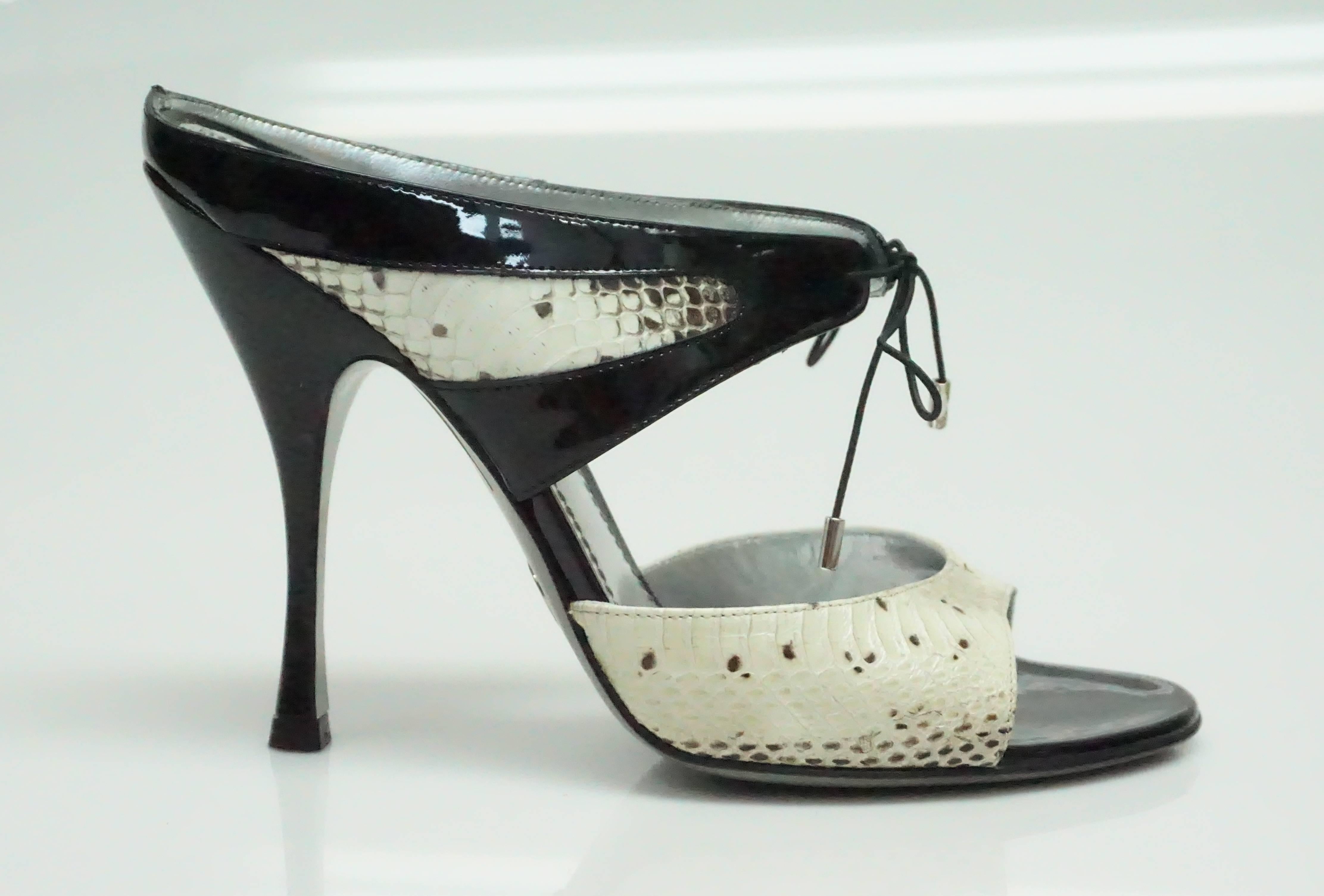 Dolce & Gabbana Ivory & Black Snake and Patent Slide - 38   These beautiful and classic shoes are in excellent condition. These shoes appear to be only worn once or twice. They are made of patent and snake. They have two straps and the first one has