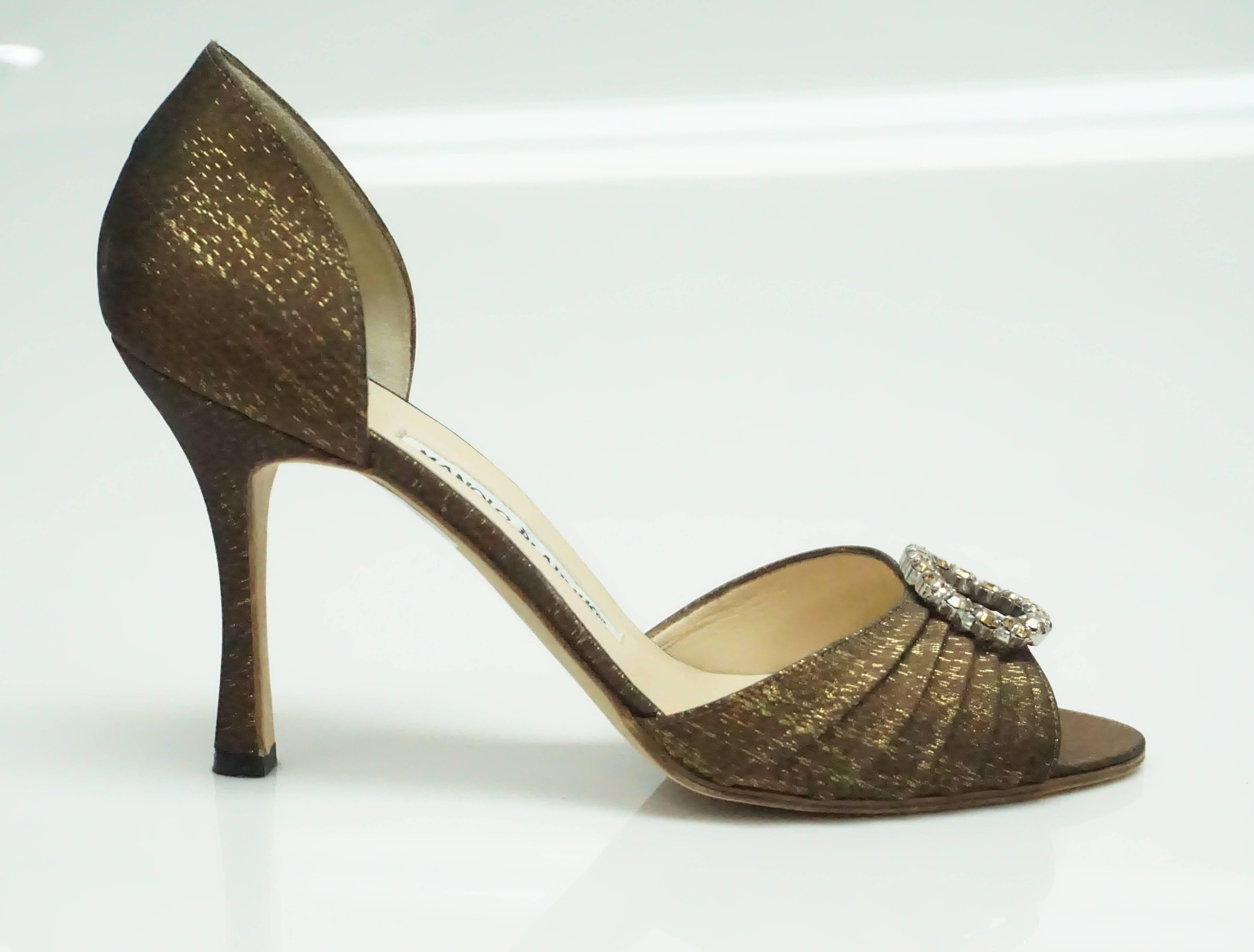 Manolo Blahnik Bronze Silk D'Orsay with Rhinestones - 38   These classic shoes are in excellent condition. They appear as if they have never been worn. The shoe has a peep toe and it embellished with a beautiful rhinestone  clasp. The shoe is made