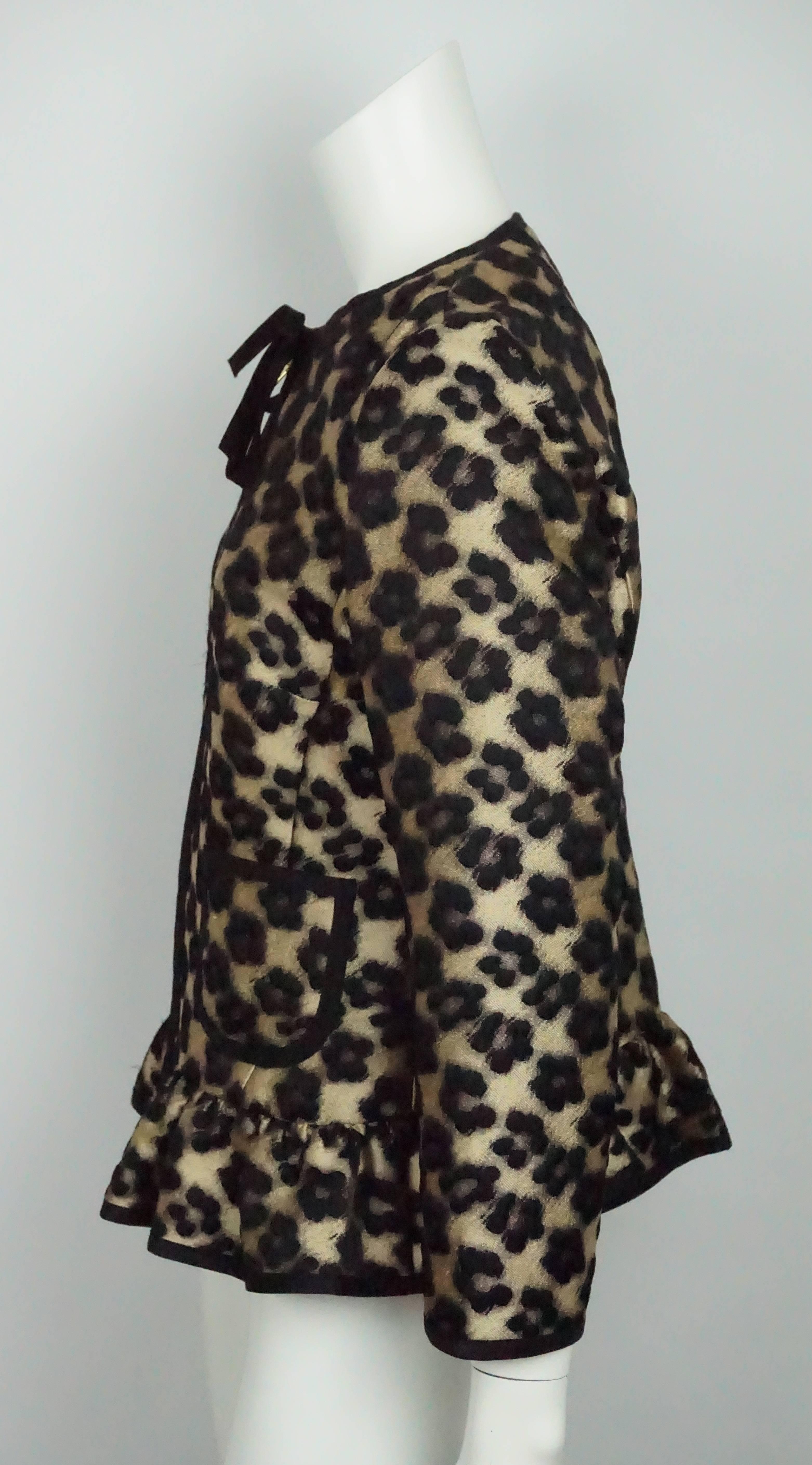 Red Valentino Gold and Black Leopard Print Silk Jacket - 8   This gorgeous leopard print jacket is in excellent condition. The jacket is a wool/ polyester blend and has no lining. There is a ribbon detail around the neckline that goes down the