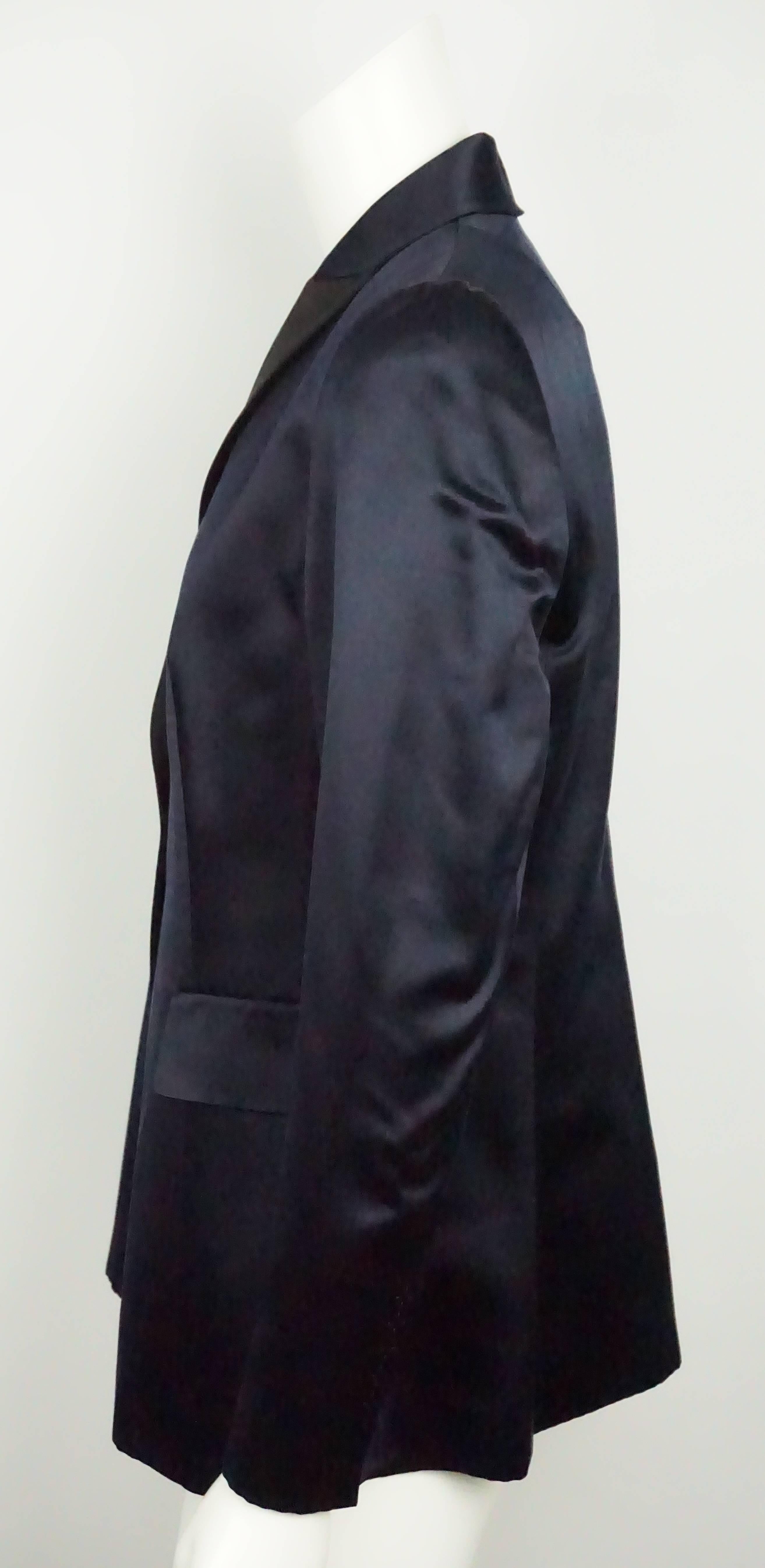 Akris Navy Satin Tuxedo Style Jacket - 10  This traditional silk tuxedo style jacket is in excellent condition. The entire jacket is navy with the exception of the lapel which is black. It has three front flaps that are not functional pockets. The