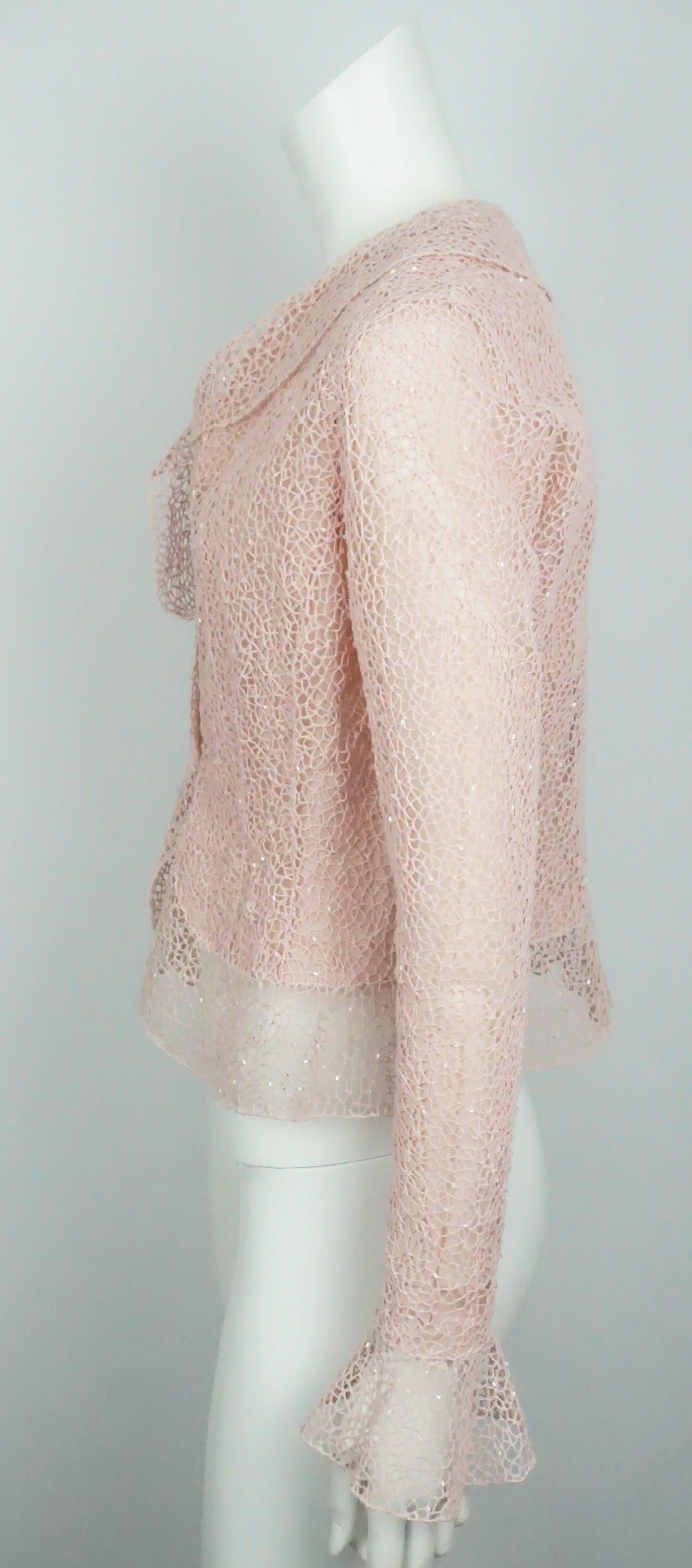 Oscar De La Renta Pink Crochet Lace Sequin Jacket - 8  This beautiful cotton jacket is in good condition. There are minor stains around the wrist and in one of the armpits of the jacket. It is lined in silk organza and there are two jewels that