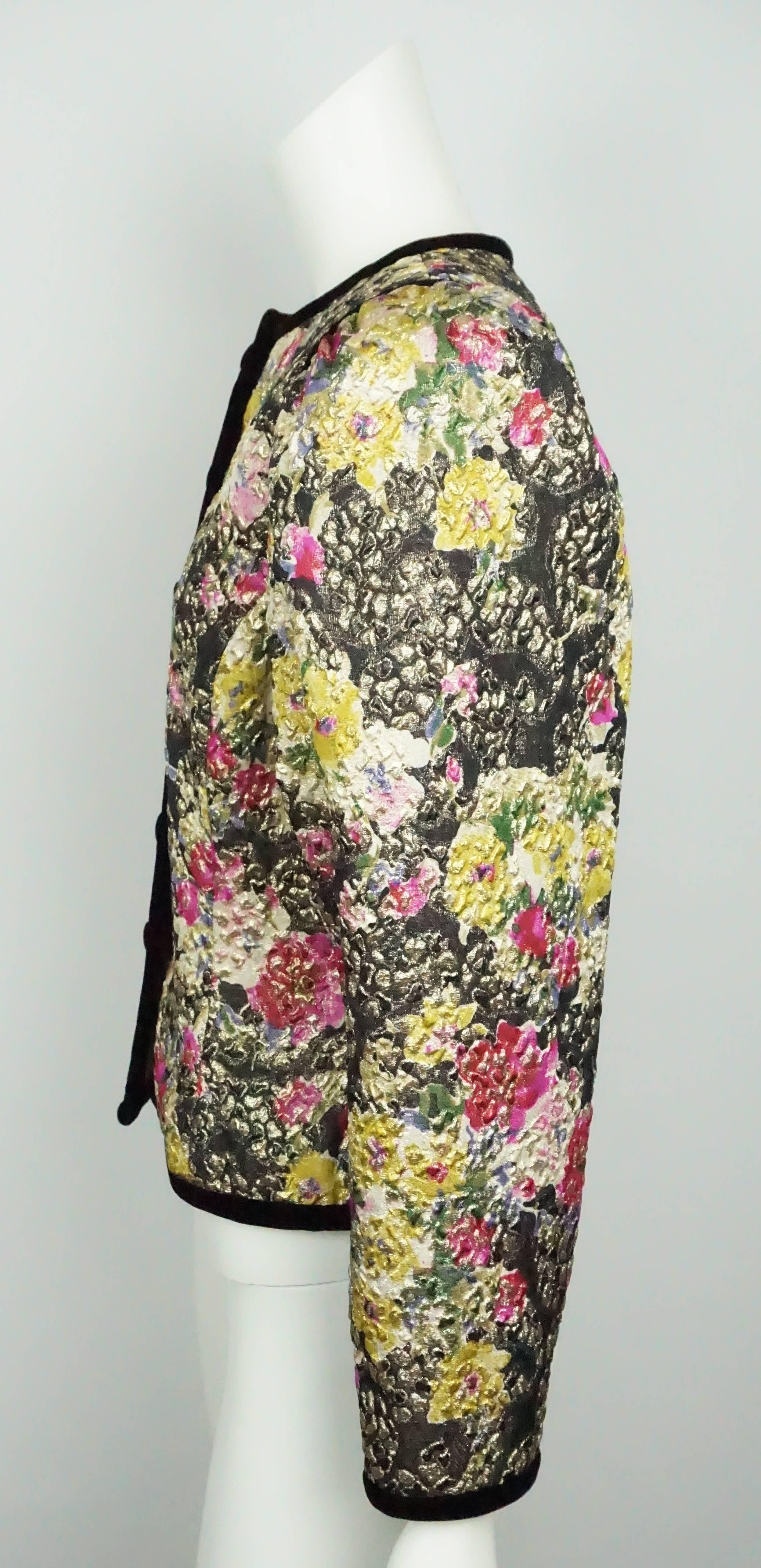 Oscar De La Renta Multi Metallic Floral Brocade Jacket w/ Black Trim - 8  This stunning vintage piece is in excellent condition. The jacket has a floral design that has a brocade effect. The jacket has trimming in black velvet and is lined in silk