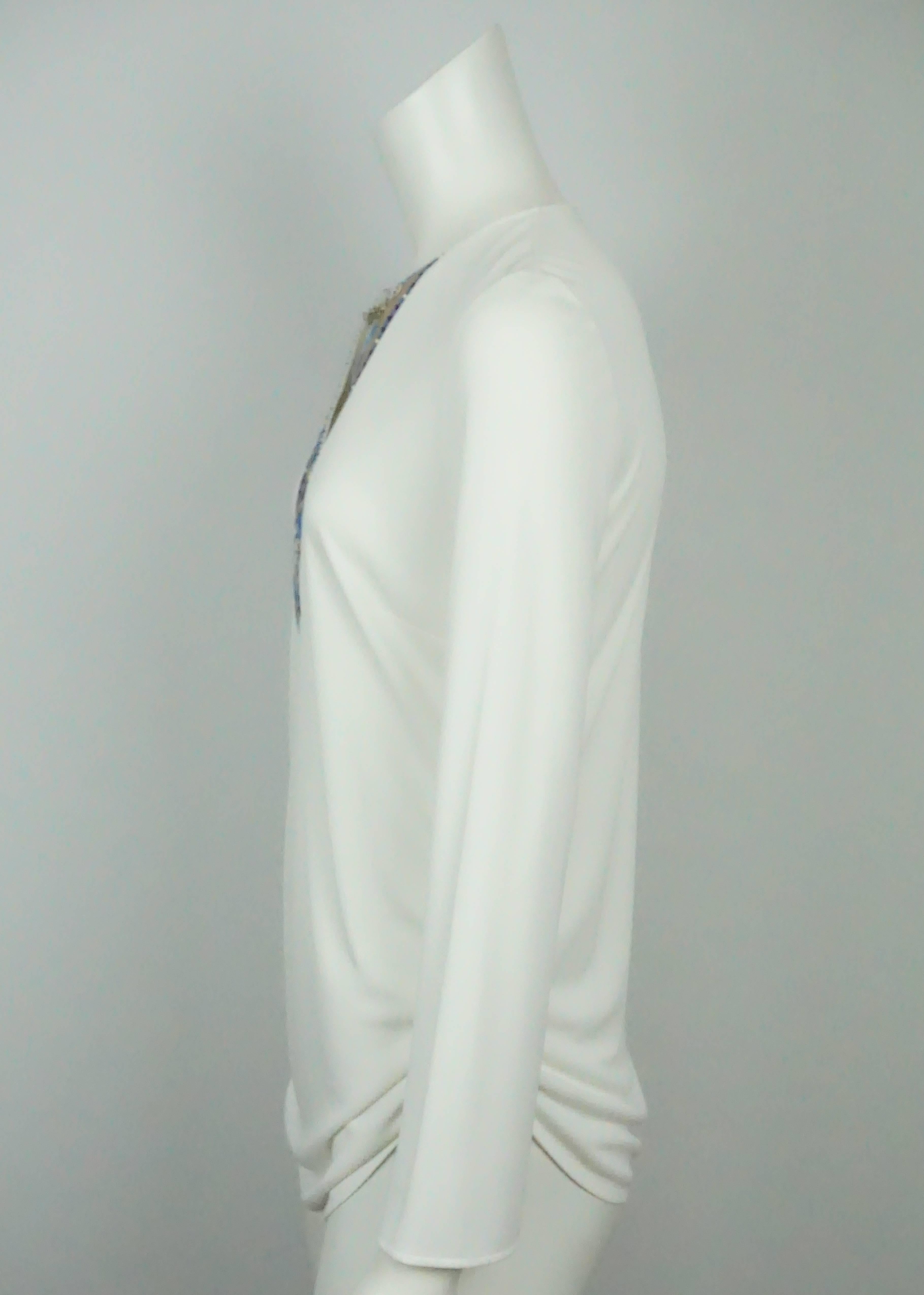 Emilio Pucci Ivory Silk L/S Top w/ Blue Print and Chain Detail - 40   This beautiful Pucci silk blend top is in excellent condition. This top has a deep v neck that is detailed with a blue, yellow, taupe, and turquoise print. Near the neckline there