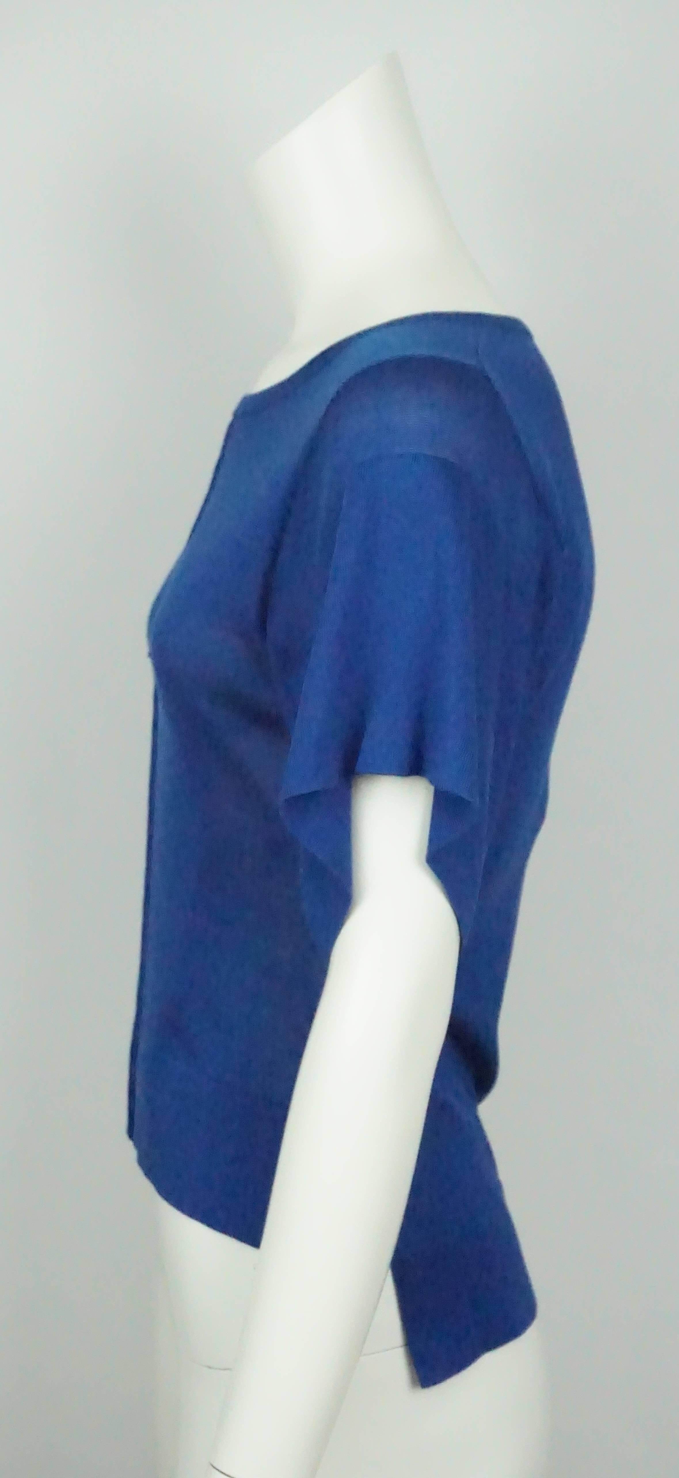 Emilio Pucci Royal Blue Silk Knit Top - XS - NWT  This top is made of a silk knit, has a round collar, short sleeve and is shorter in the front and longer in the back. The top is new and has the tags still hanging. 
Measurements:
Shoulder to