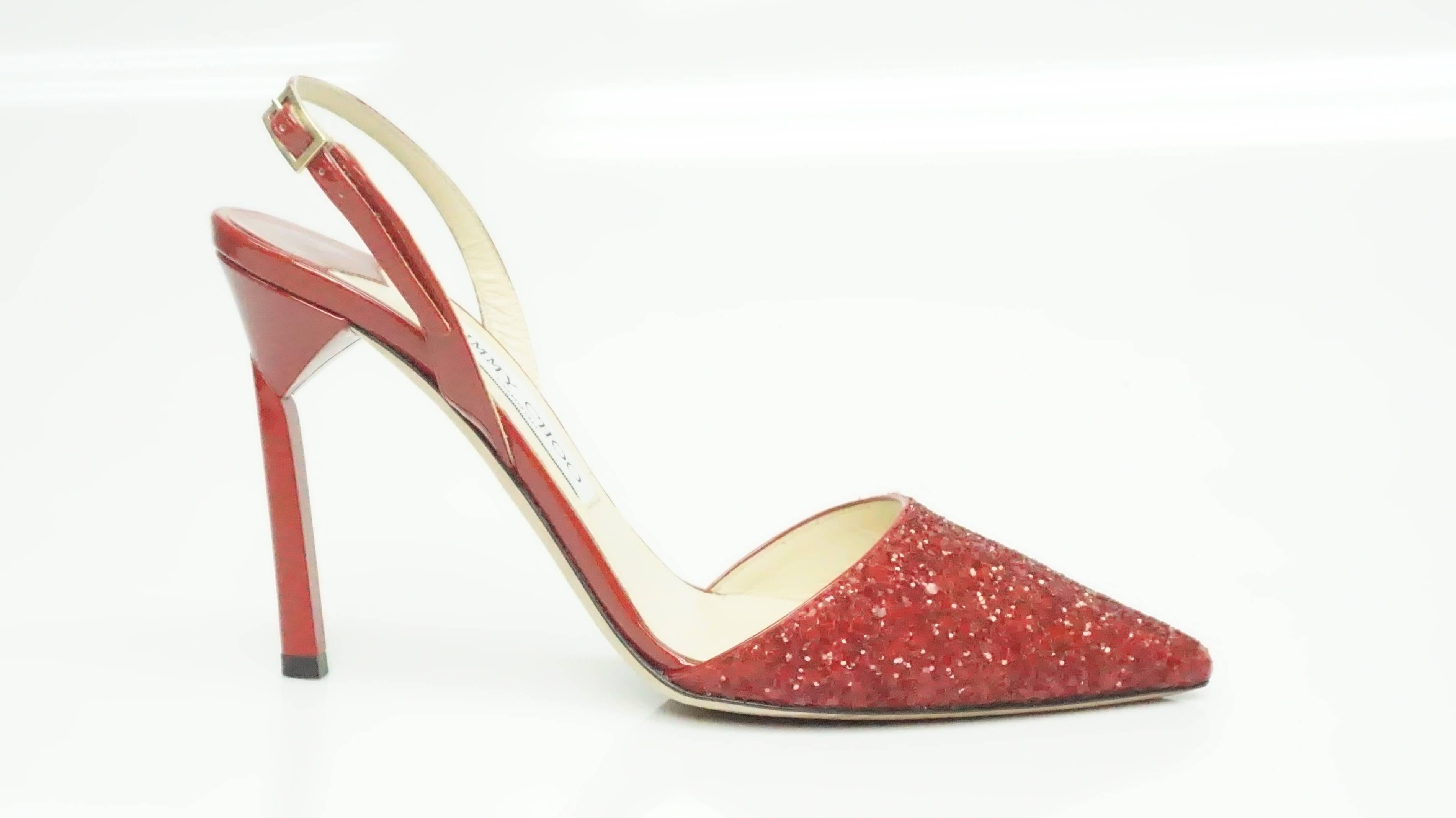 Jimmy Choo Red Slingback w/ Sequin - 36.5  This gorgeous pump is in excellent condition. The shoe has a pointed toe and it is completely covered in red glitter and sequins. The rest of the shoe is made of patent leather. There is a slingback that