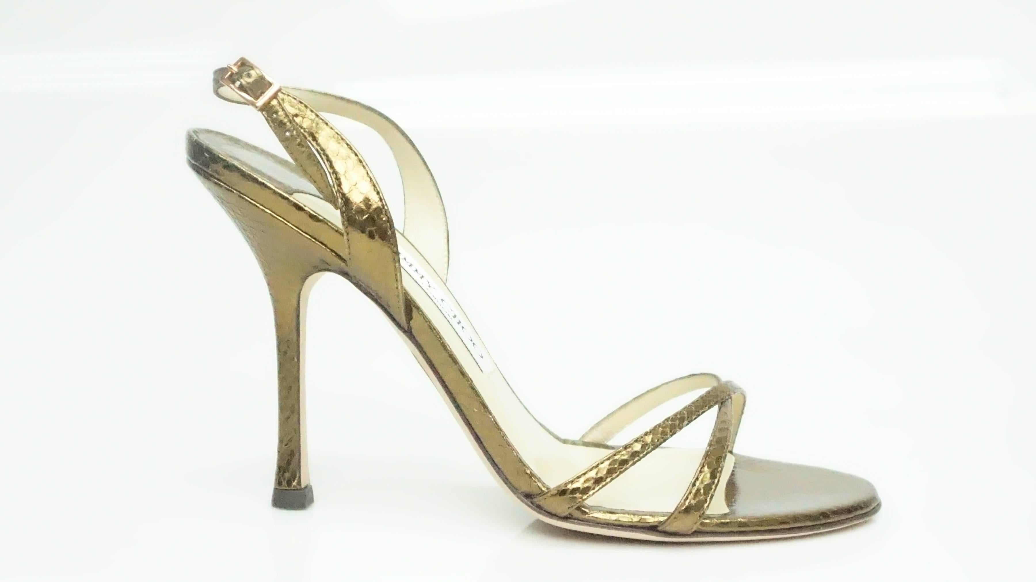Jimmy Choo Watersnake Copper Strappy Heel - 39 These beautiful water snake heel is in excellent condition. These appear to be never been worn. The front of the shoe has a criss cross effect and there is a slingback on the back. The entire shoe is