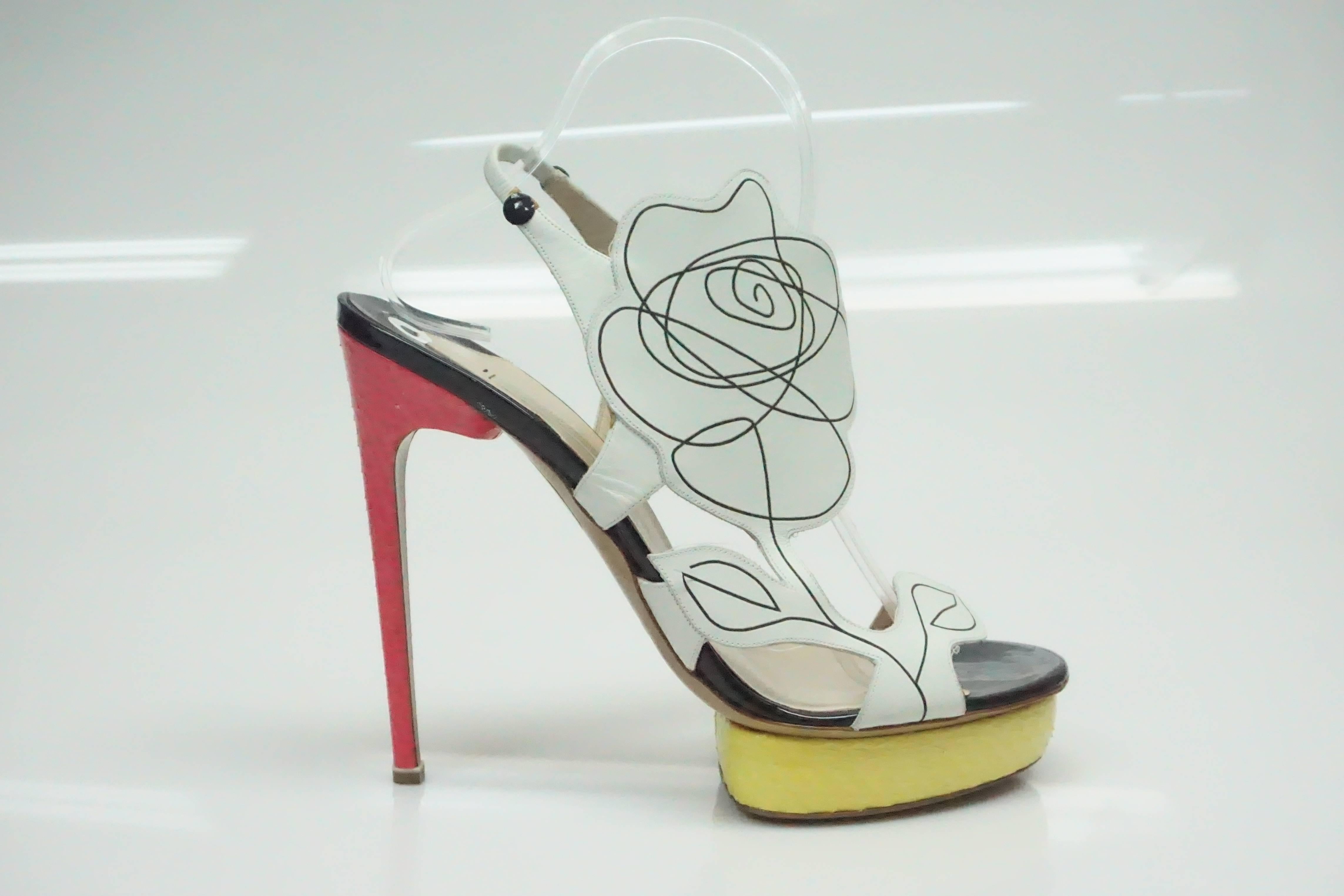 Nicholas Kirkwood Multi Floral Yellow/Pink Python Shoes - 41  This gorgeous shoe is in excellent condition. They appear as if they have never been worn. The platform is made out of python and is a yellow color. The heel is the same material and is