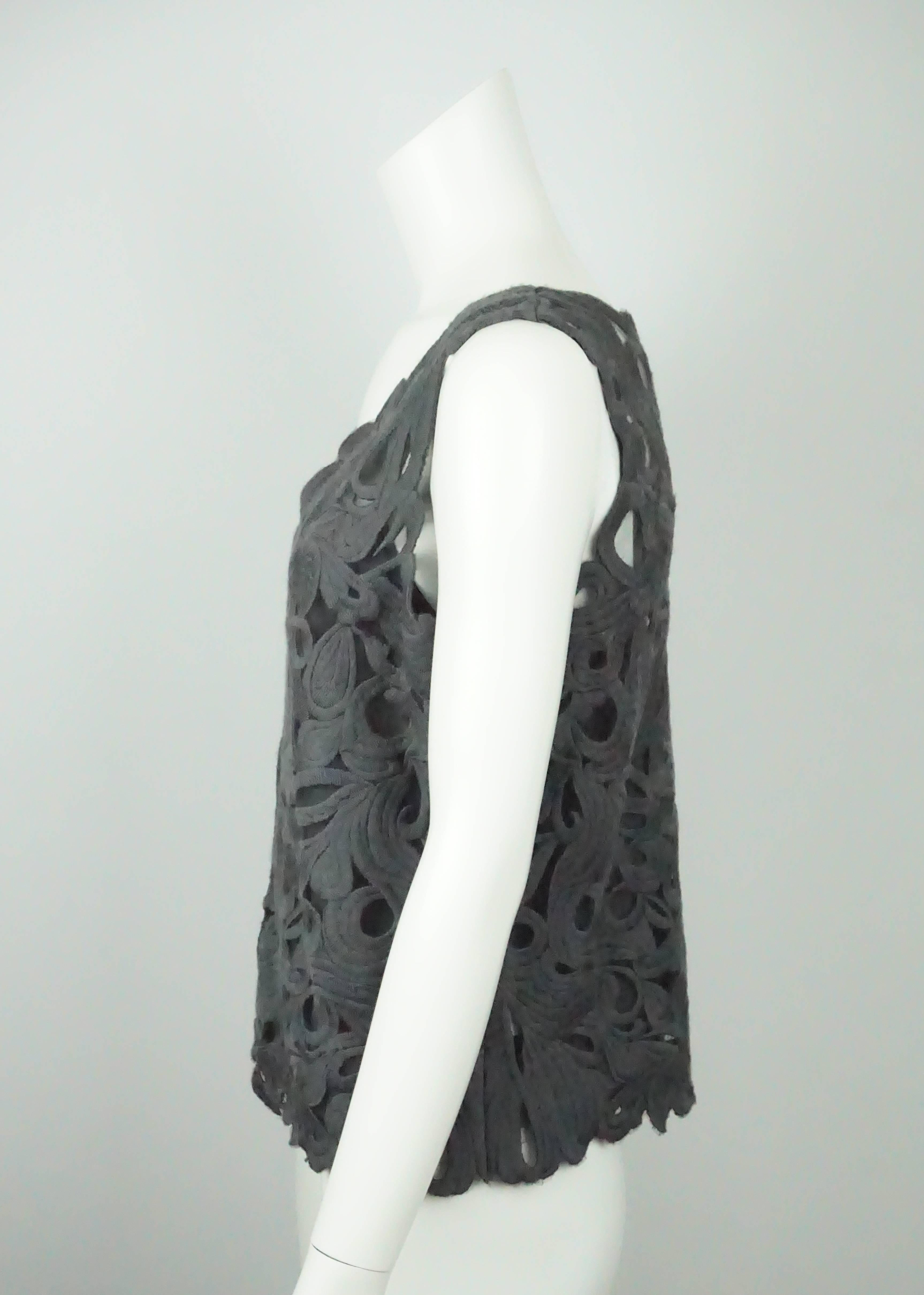 Les Copains Grey Wool Lace Sleeveless Top - 46  This gorgeous top is new with tags. It is sleeveless and has a beautiful cutout detail to it. There is a grey cami underneath the top. On the left side of the top there is also a zipper. 
Measurements