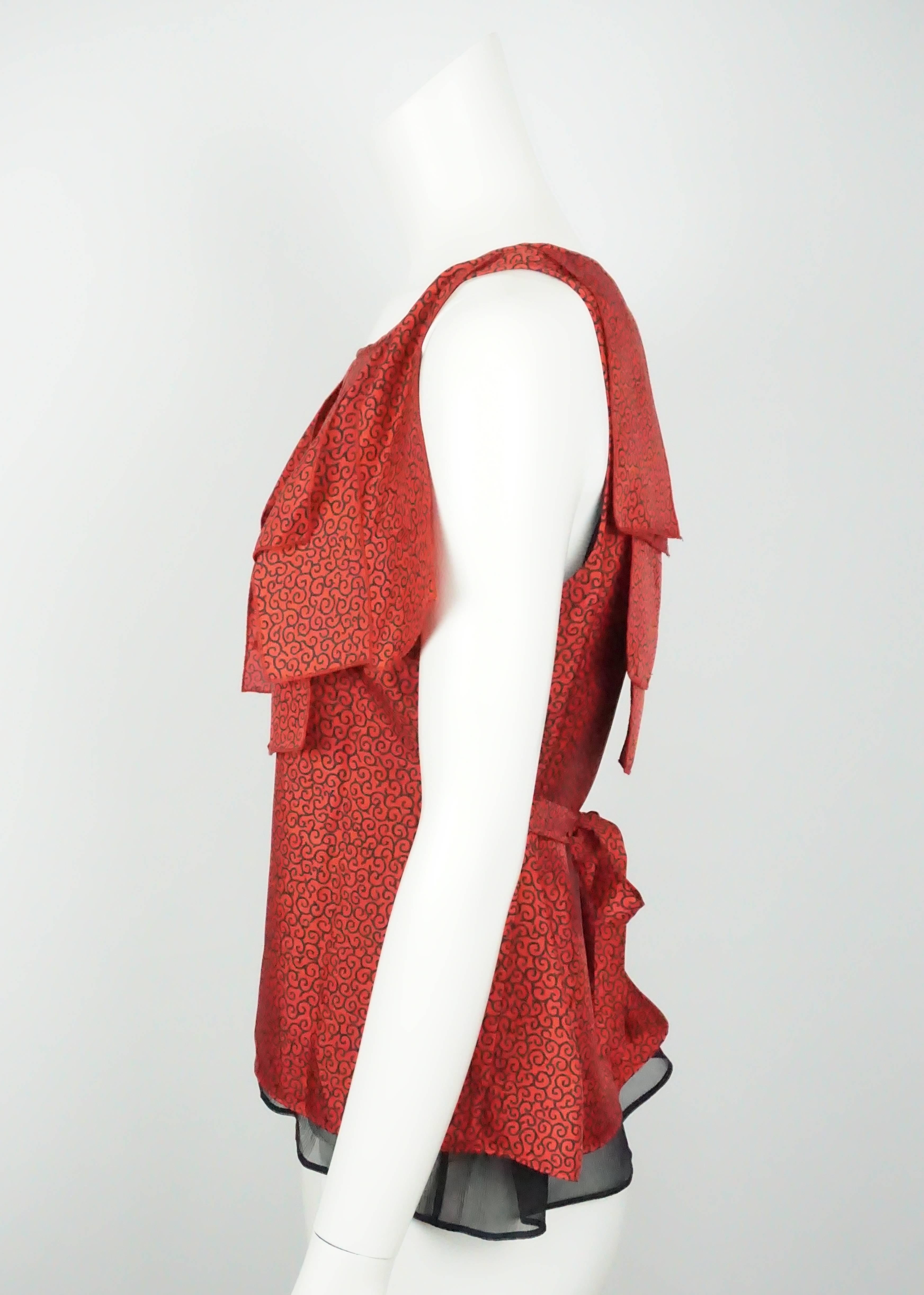 Etro Red and Black Filigree Silk Sleeveless - 44 - NWT This beautiful top is new with tags. The entire top is covered in a filigree design. The front and back of the top have a flaps hanging from the neckline. There are two straps hanging from the