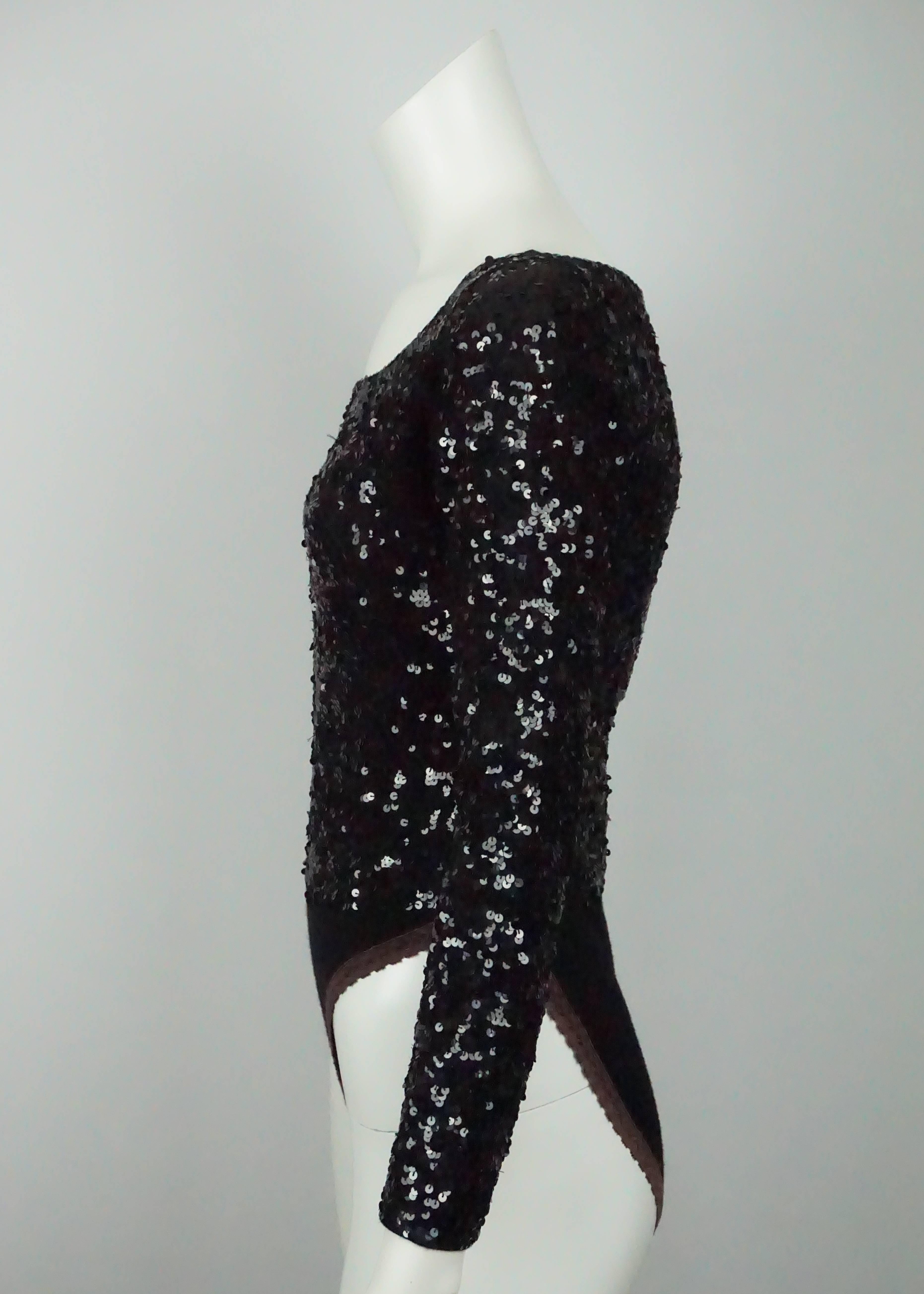 Donna Karan Black Sequin Bodysuit - Medium  - Circa 80's This beautiful wool black sequin bodysuit is in good condition. The bodysuit has a round neckline and has long sleeves. The entire top is embellished in black sequins. From the waist down, the