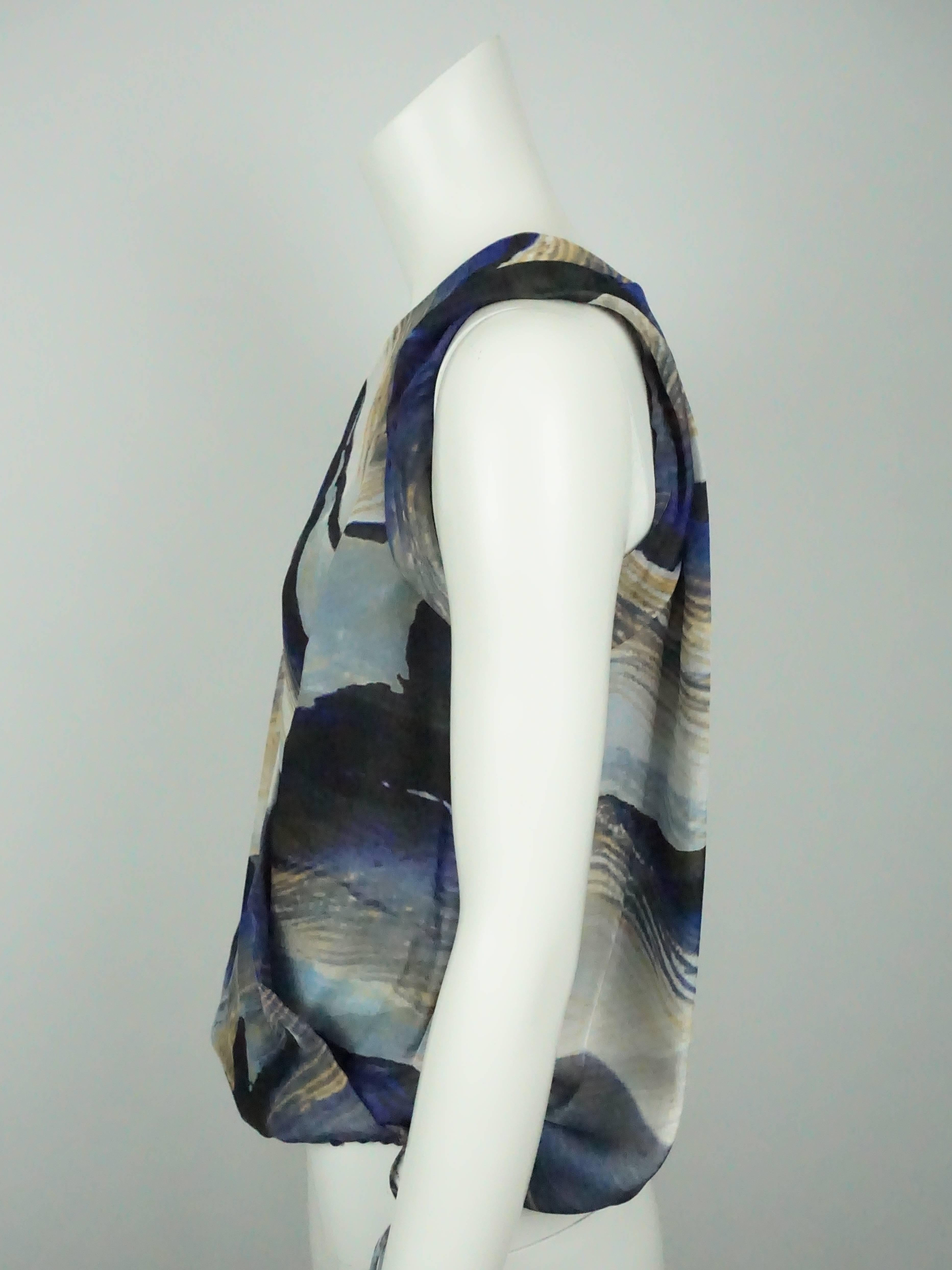 Robert Rodriguez Blue Printed Silk Chiffon Sleeveless Top - 4  This top is made with a double layer of silk print fabric and fits as a blousy/loose style. The top crosses in the front with a v-neck line, a snap at the chest, and a draw string at the