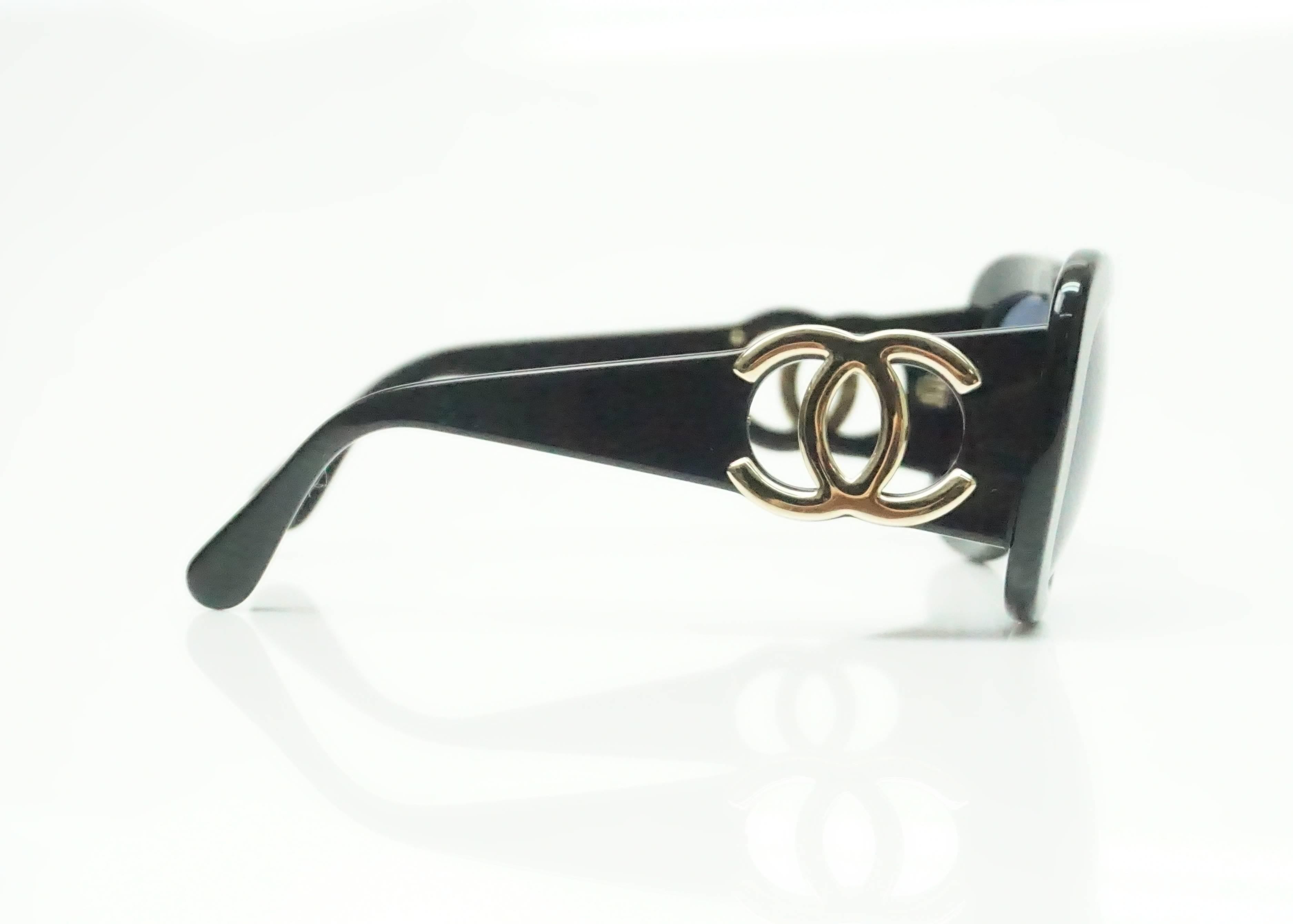 Chanel Black w/ Gold CC Logo Sunglasses  These classic Chanel glasses are in good condition. There is a slight crack on the left leg near the CC logo. 
Measurements 
Front: 5.5