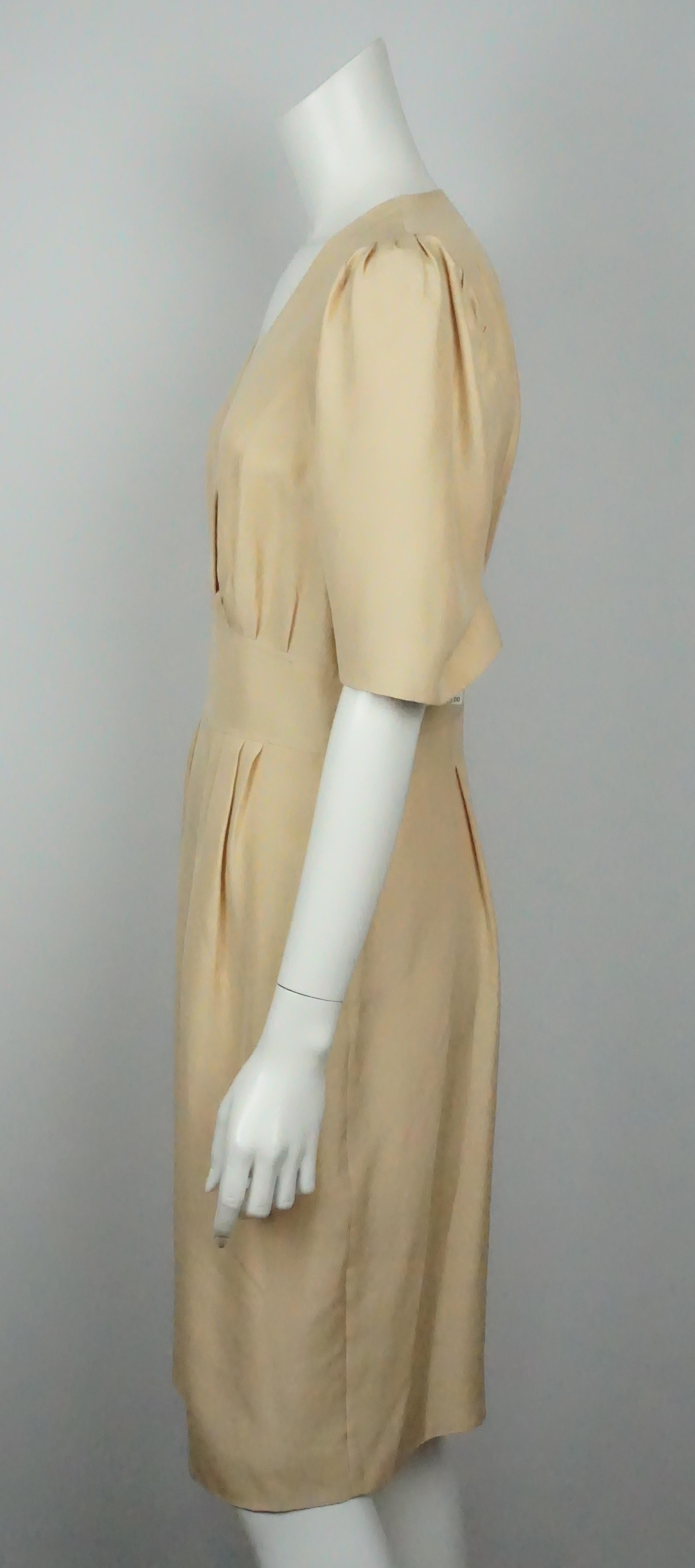 Chloe Beige Silk Dress - 38  This gorgeous classic silk dress is in excellent condition. The dress is lined in silk and has a left side zipper. There are over sized sleeves that hit right around the elbow. The neckline forms into a v neck and there