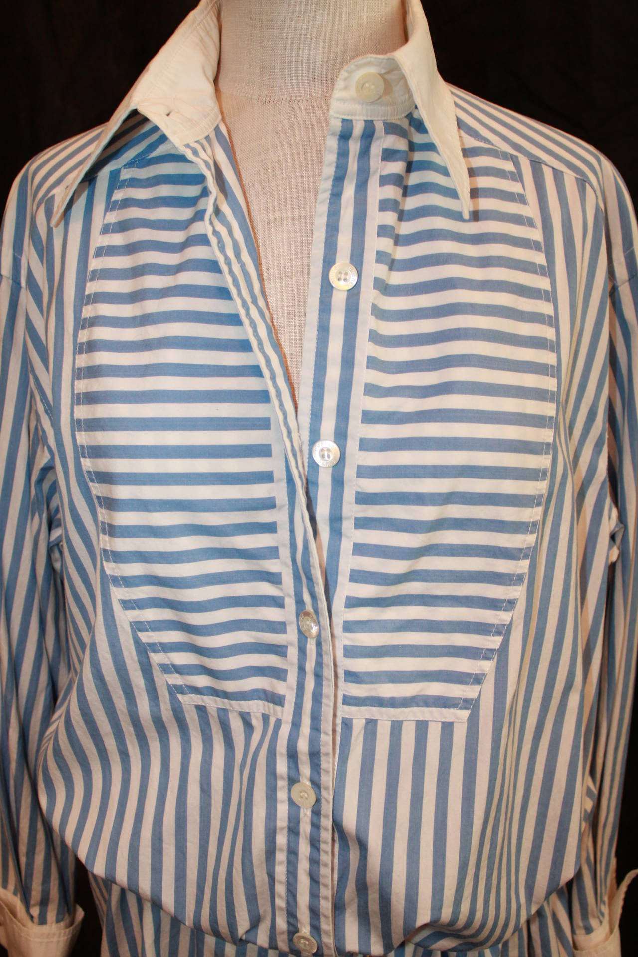Chanel Sky Blue & White Striped Shirt Dress - L. This dress is in very good condition and is from the early 2000s. It is a large but can be worn by smaller sizes because of the fit. Belt is not included with the dress. 

Measurements:
Sleeve